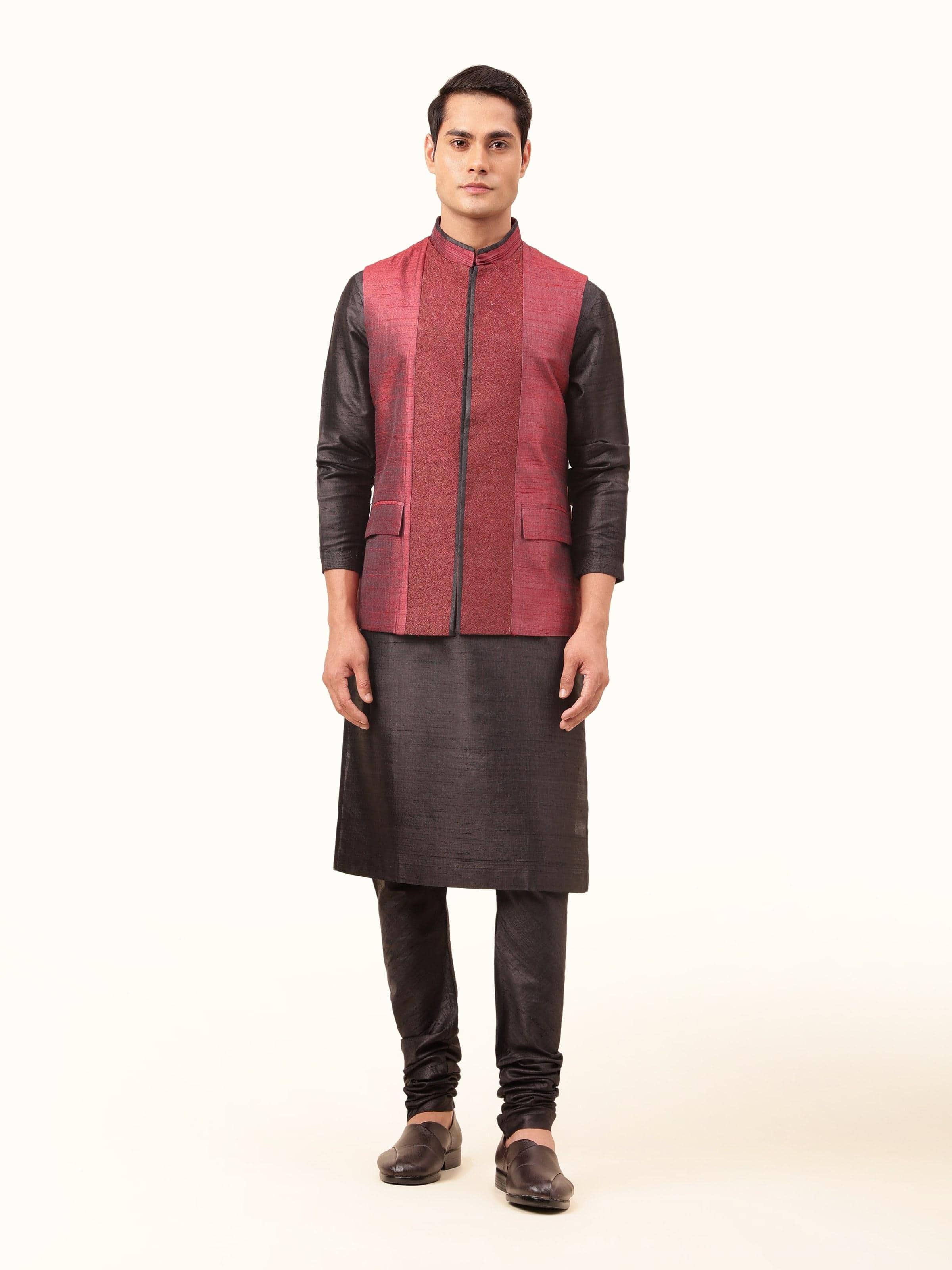 Front view showing the rich maroon color and sleek, sleeveless cut.