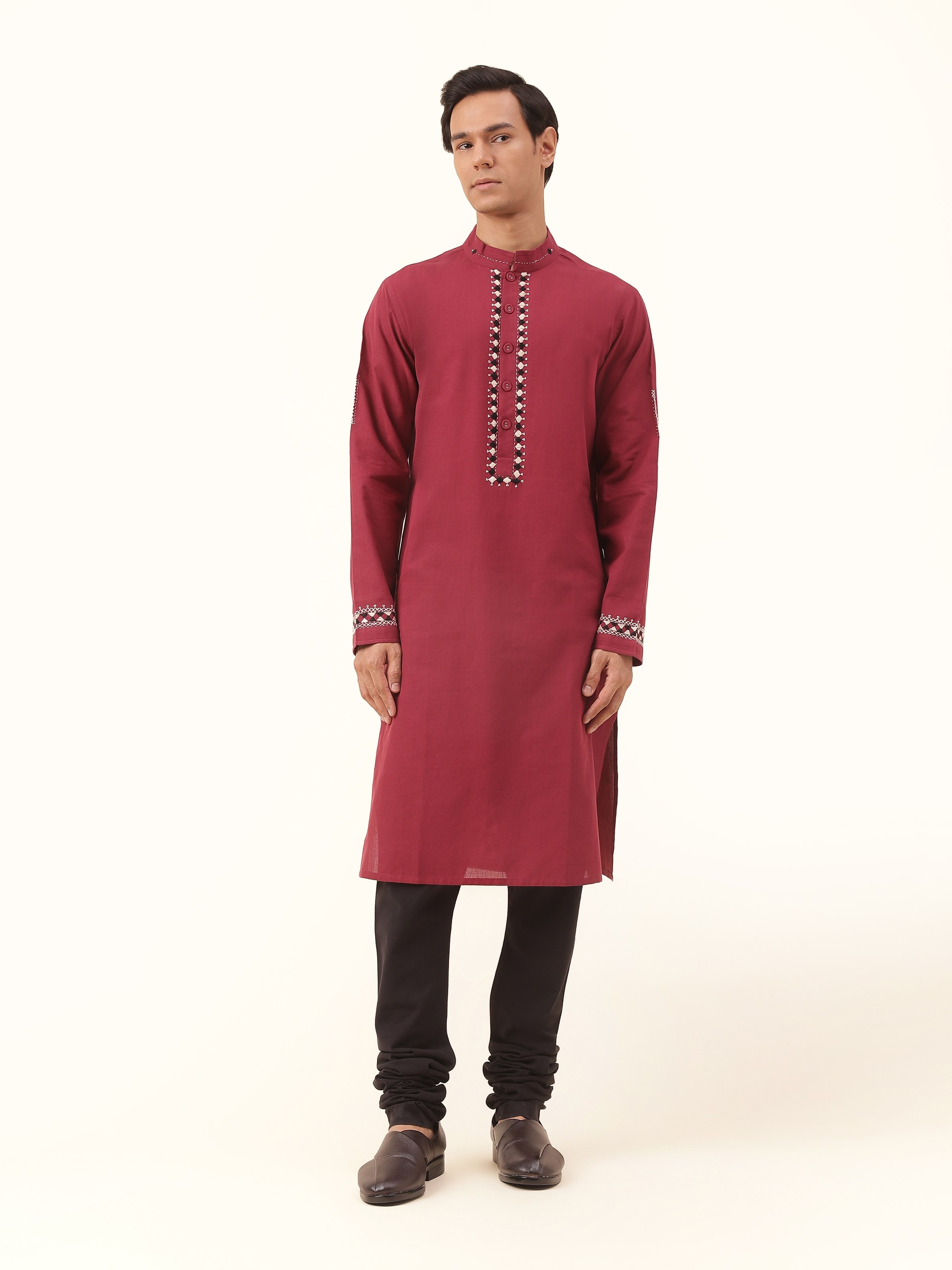 Front view of maroon cotton embroidered long kurta with floral threadwork on neckline