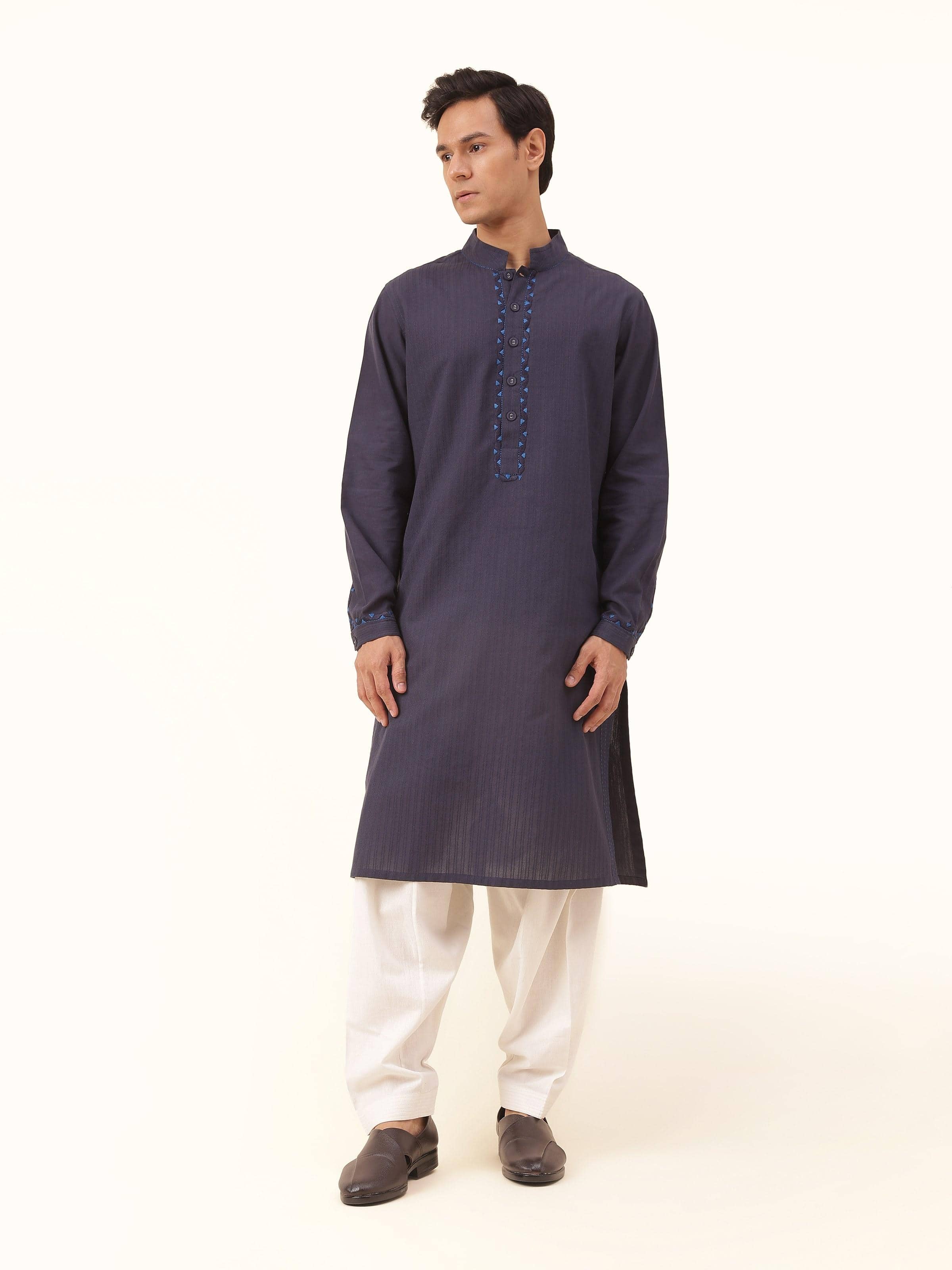 Front view of navy blue cotton long kurta with intricate Soof embroidery on the neckline and sleeves.
