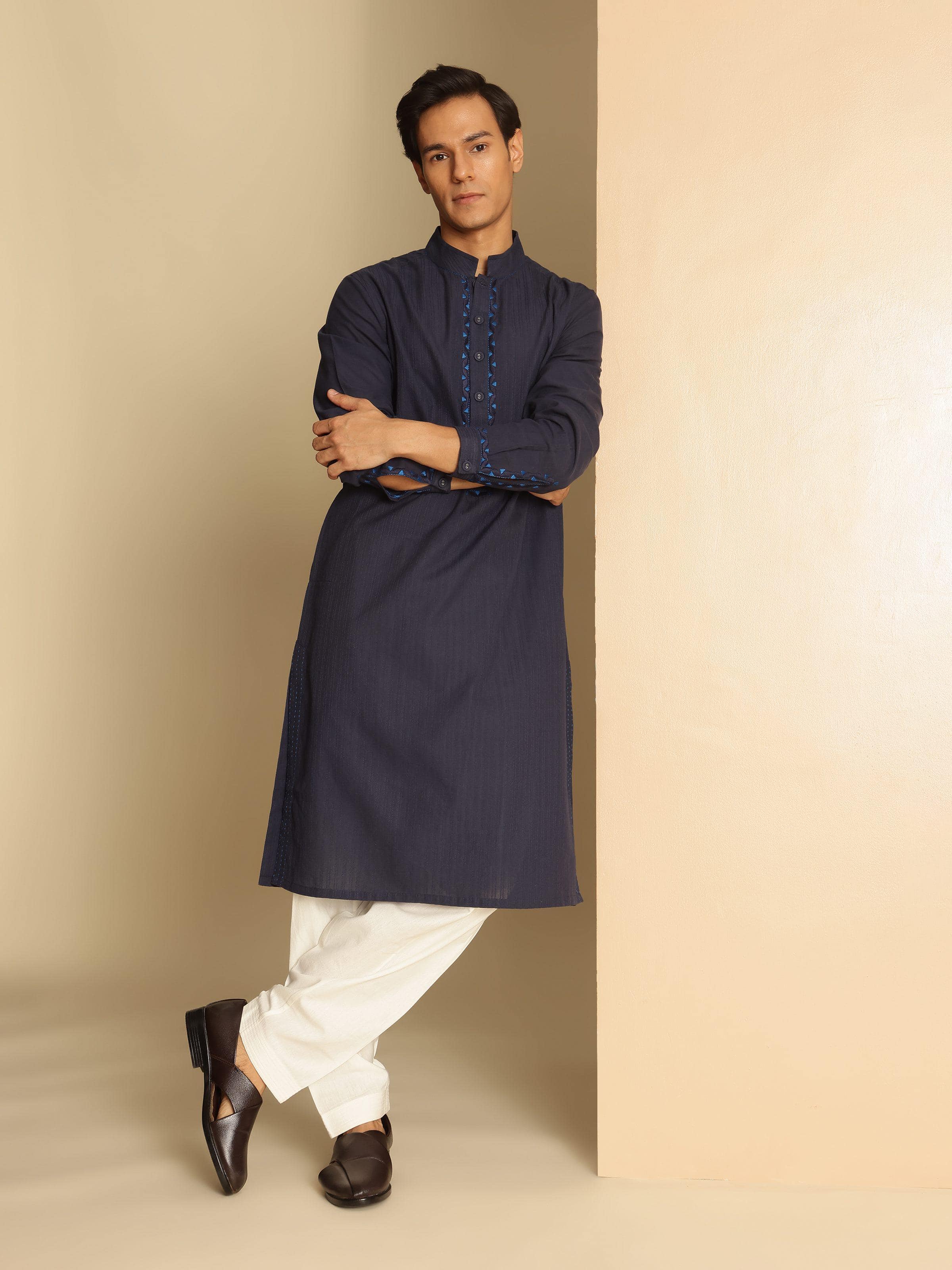 Model wearing navy blue embroidered Soof kurta showcasing full-length front design and comfortable fit.