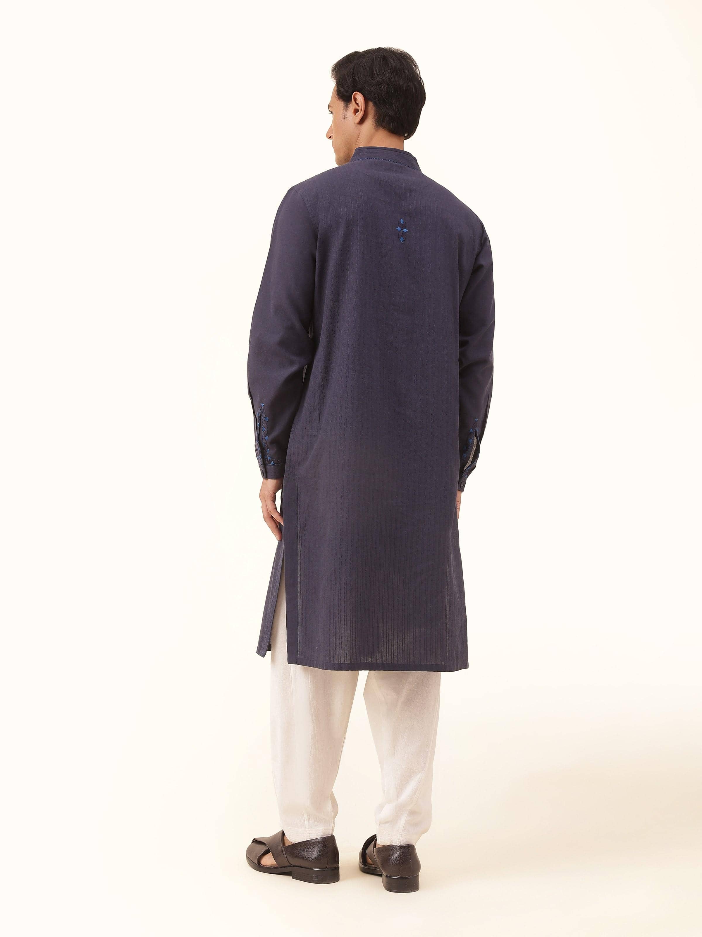 Back view of long navy blue cotton kurta with minimal design and straight-cut silhouette.