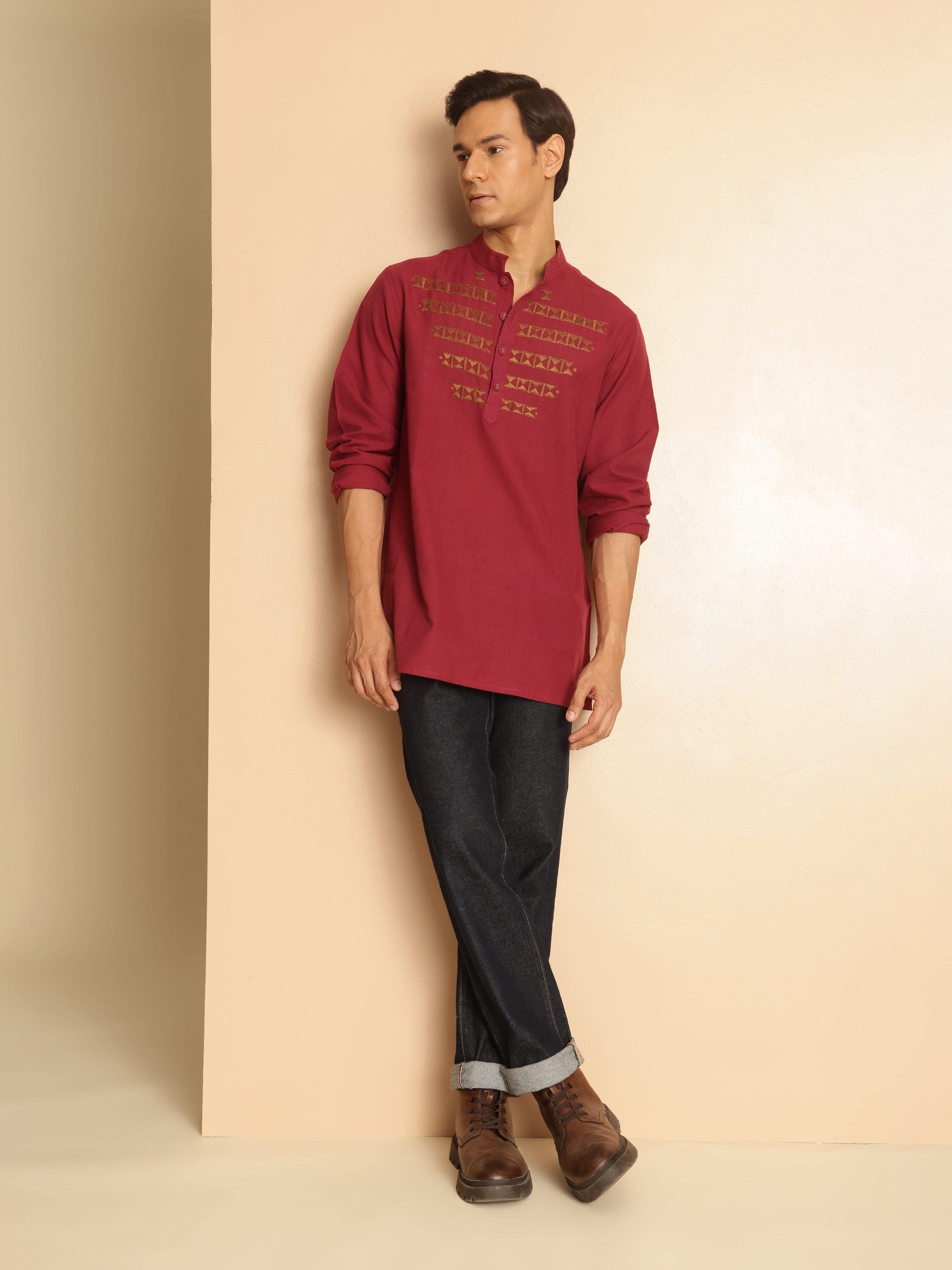 Lifestyle view of maroon cotton kurta paired with ethnic accessories and jewelry