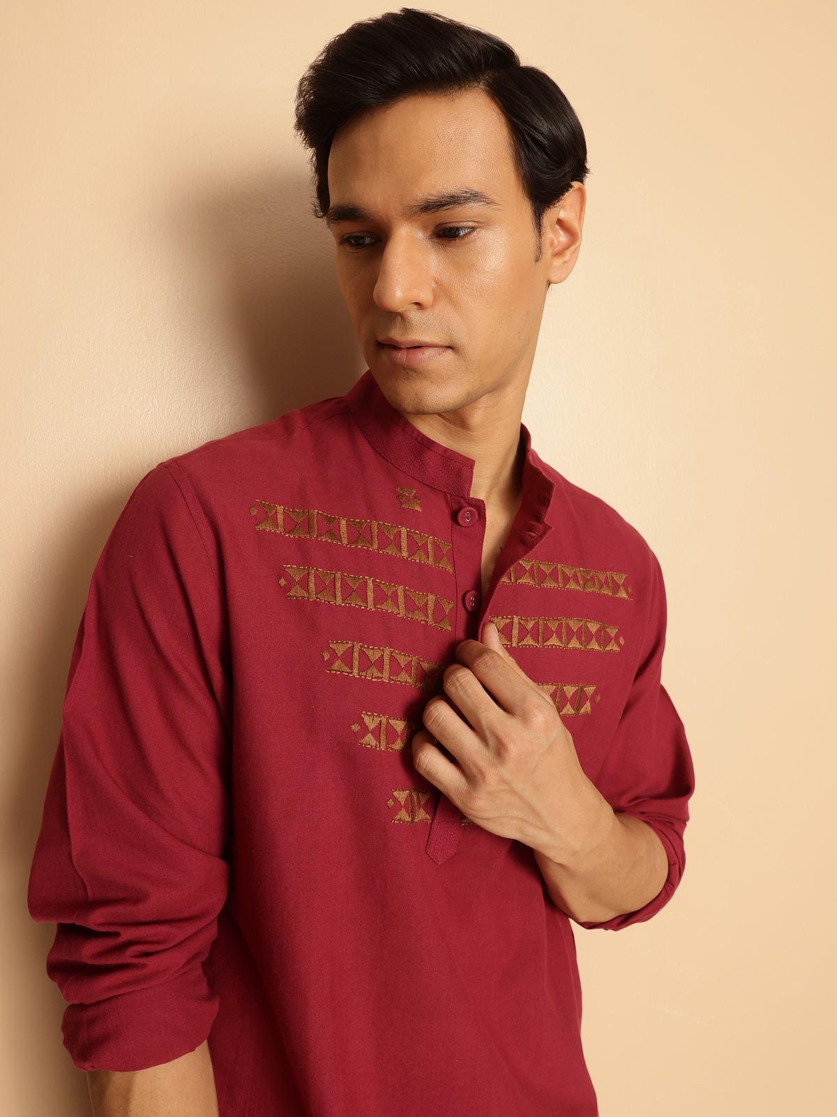 Close-up detail of cotton fabric and embroidery on kurta front and sleeves