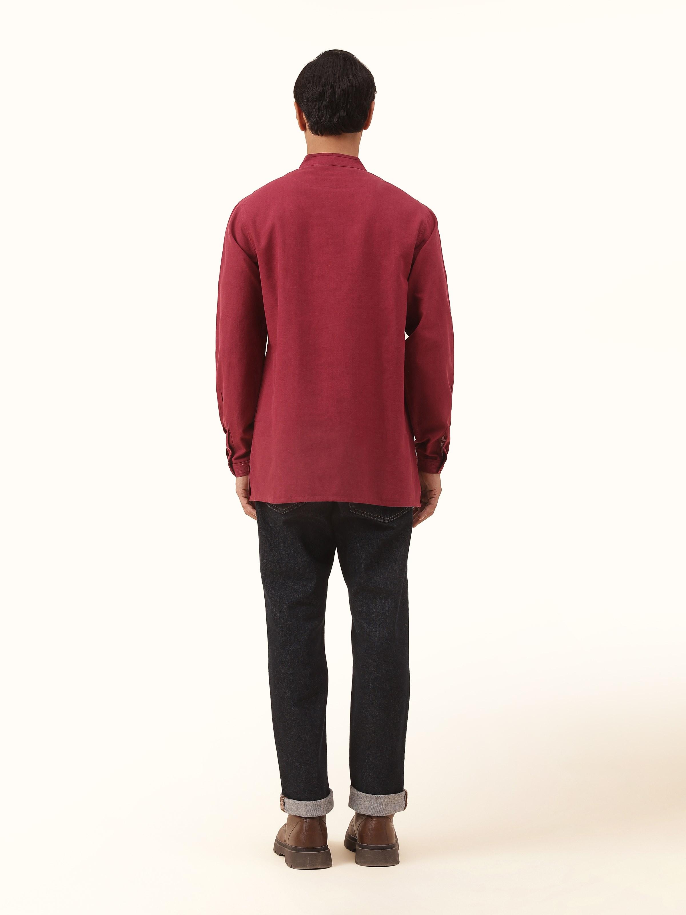 Back view of maroon cotton kurta showing simple tailoring and embroidery finish