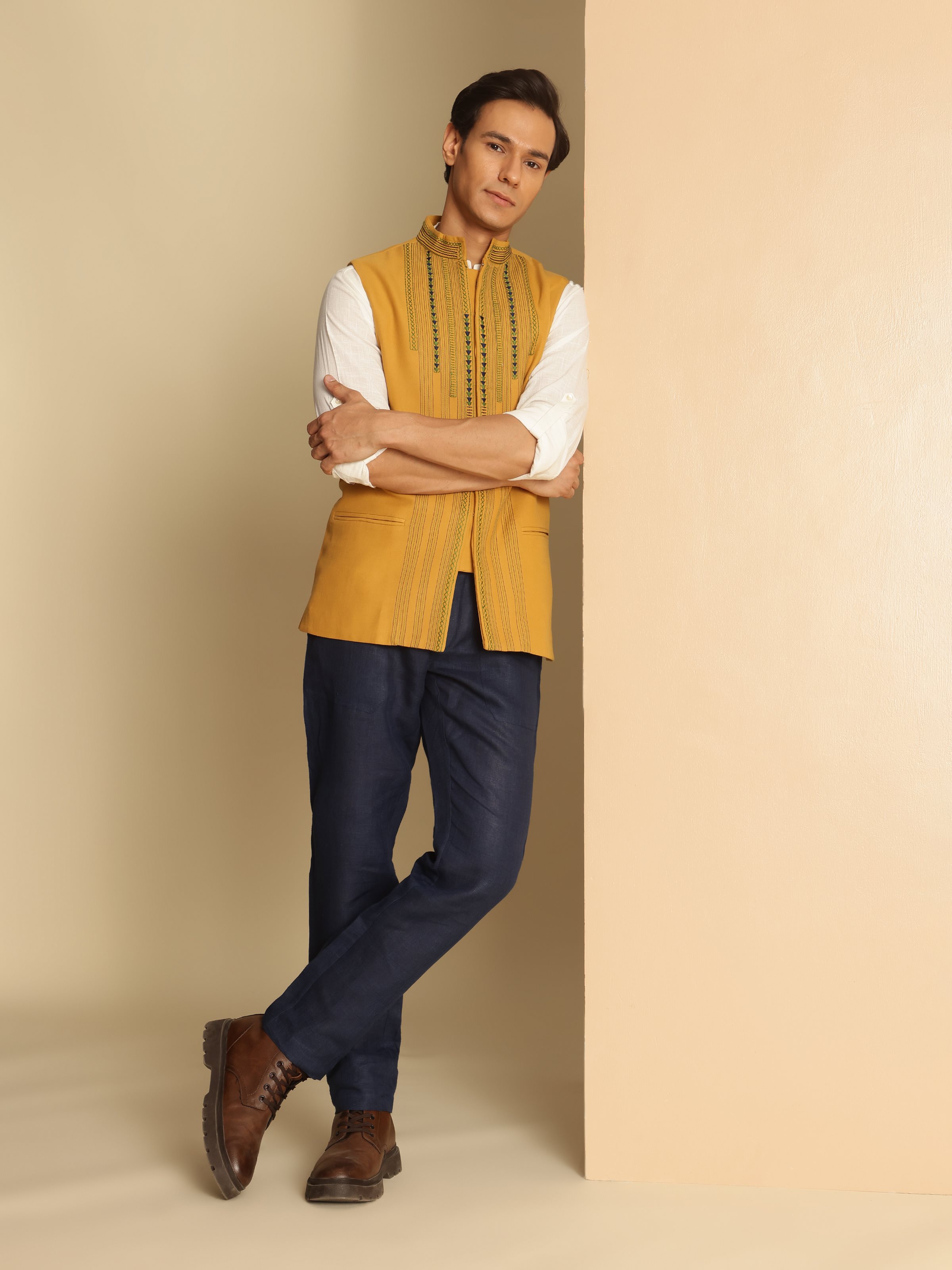 Side view of Mustard Cotton Sleeveless Jacket highlighting traditional Soof embroidery on cotton fabric.