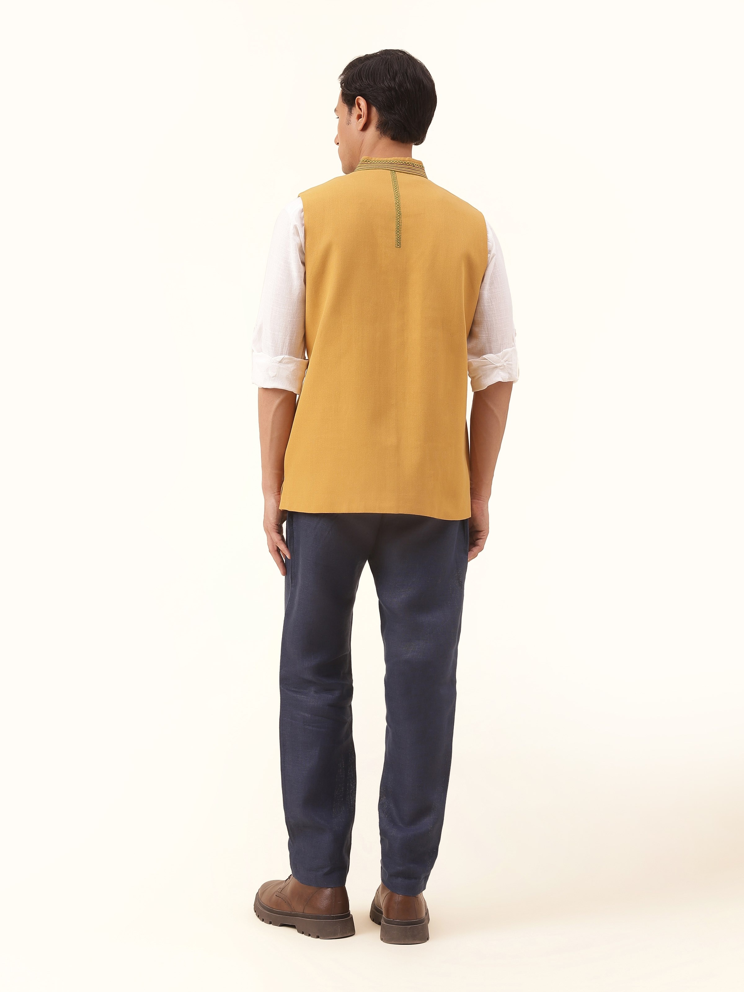 Back view of Mustard Cotton Soof Embroidered Sleeveless Jacket displaying clean stitching and rear design.