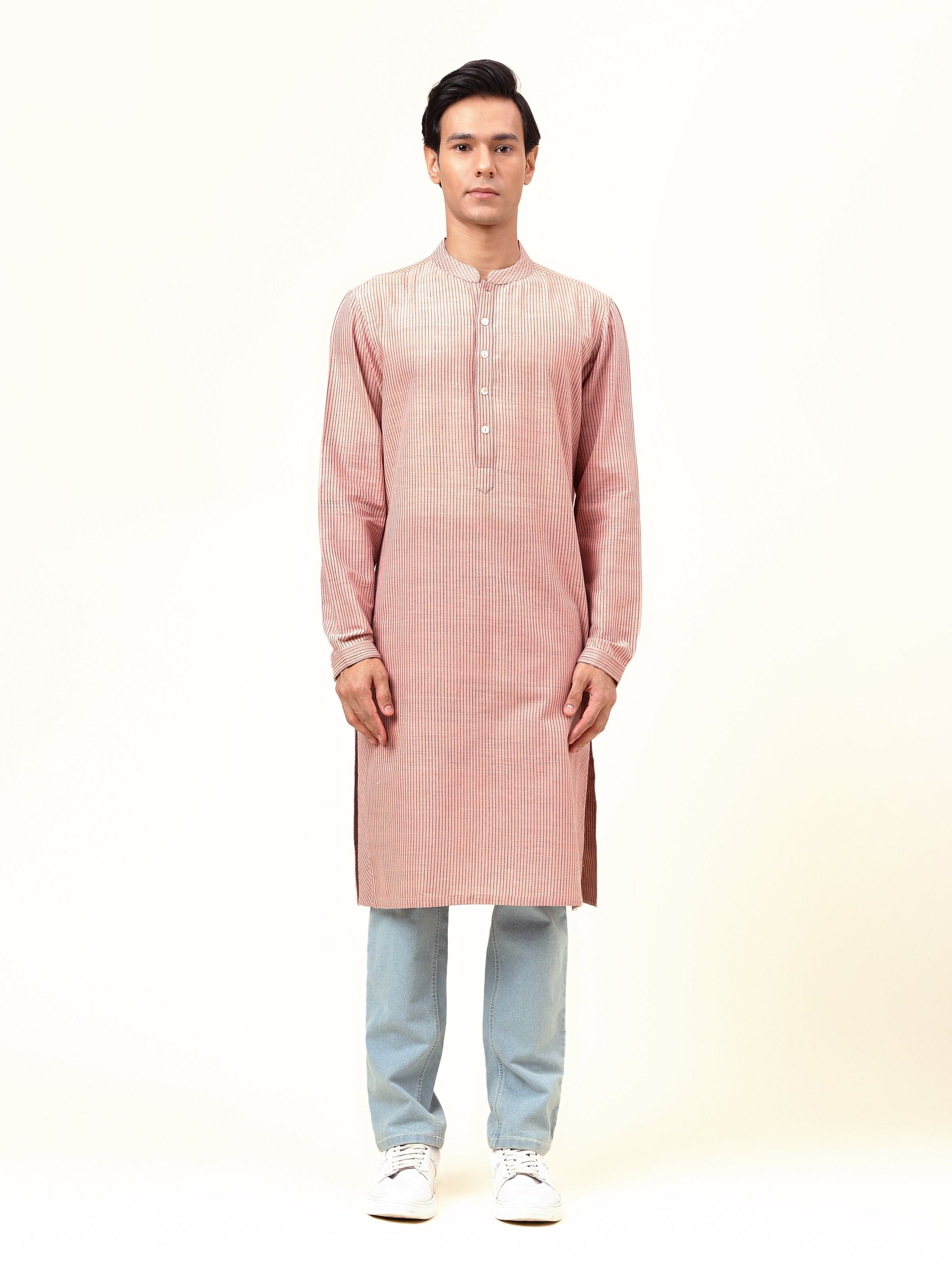 Front view of light pink cotton long kurta with button placket and subtle texture design.