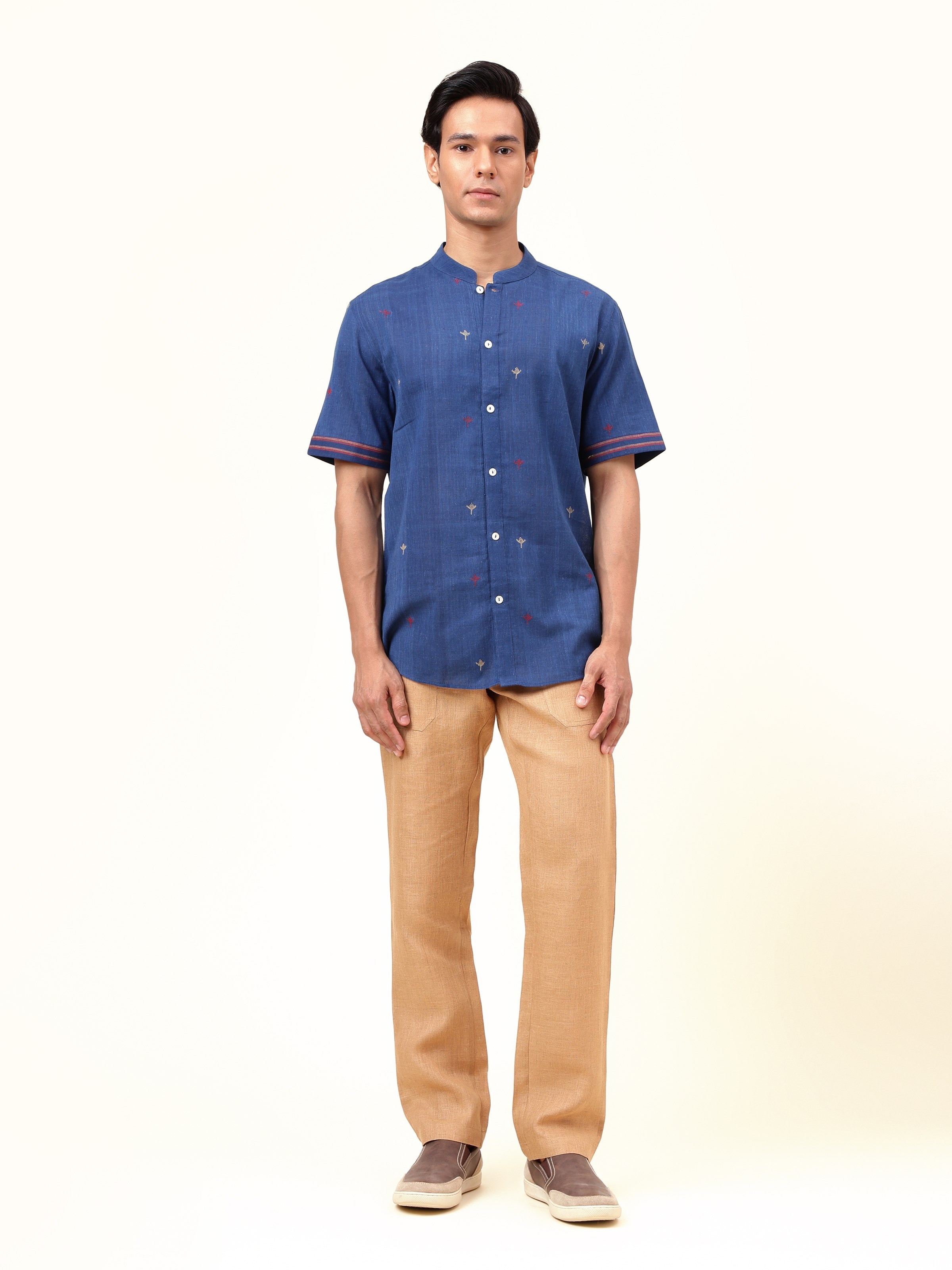 Front view of blue cotton shirt with classic collar and button placket