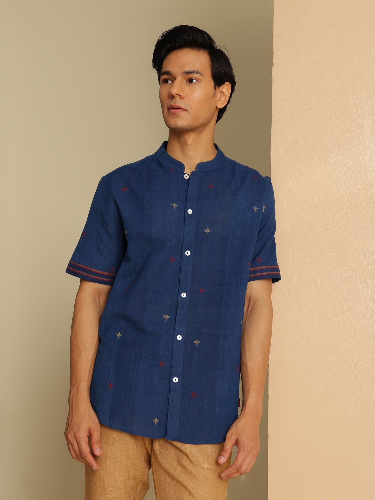 Angled shot of blue cotton shirt highlighting fabric texture and fit