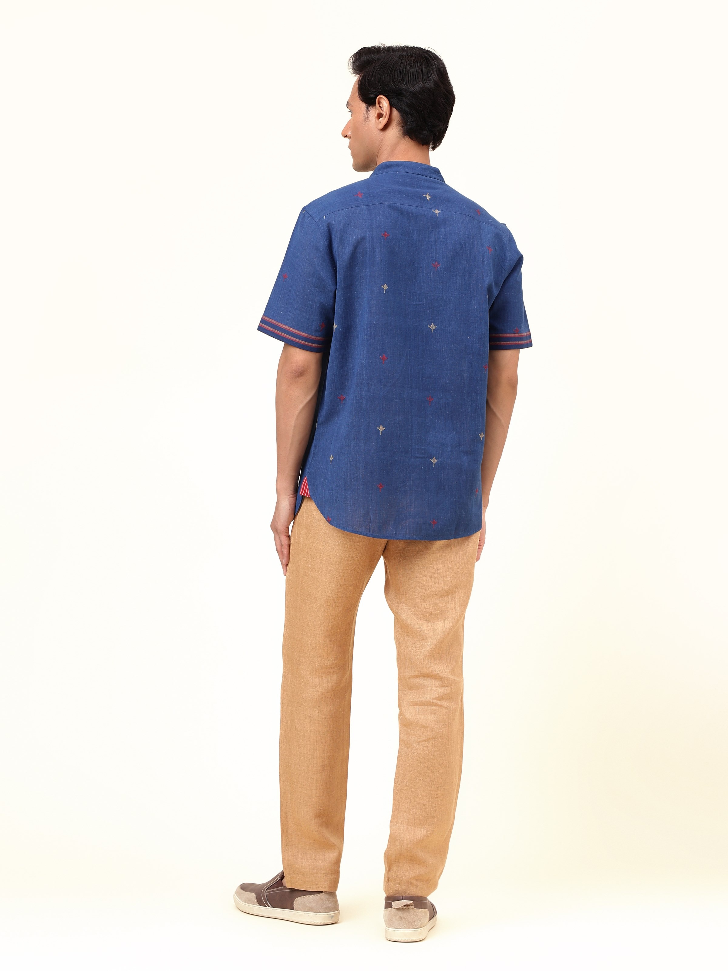 Back view of blue cotton shirt showing seam and stitching details