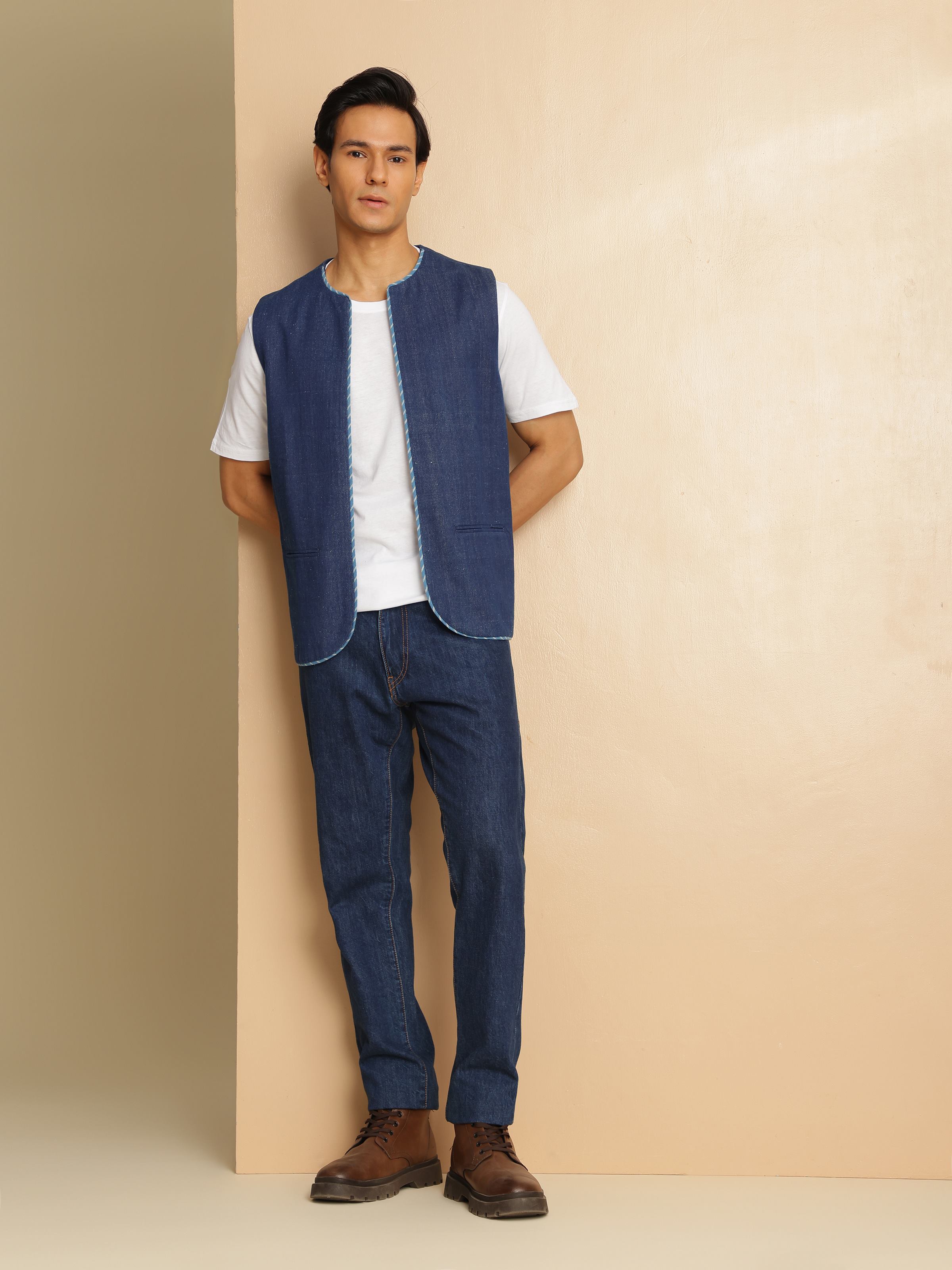 Lifestyle shot of Navy Blue Cotton Textured Sleeveless Jacket worn over casual attire
