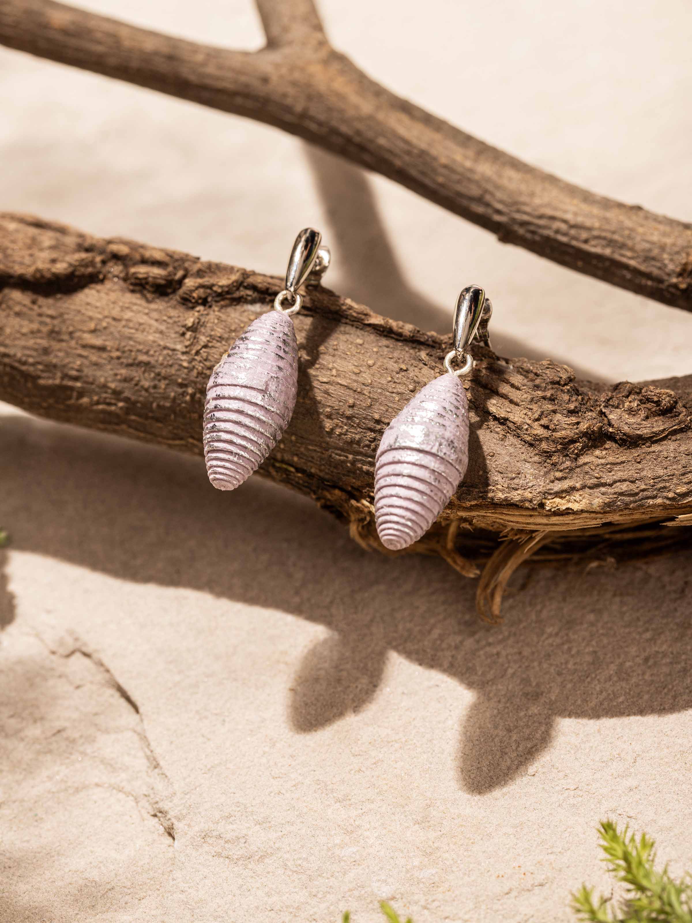 Side view of Paper Drop Earrings showcasing the elegant drop design and intricate paper detailing.