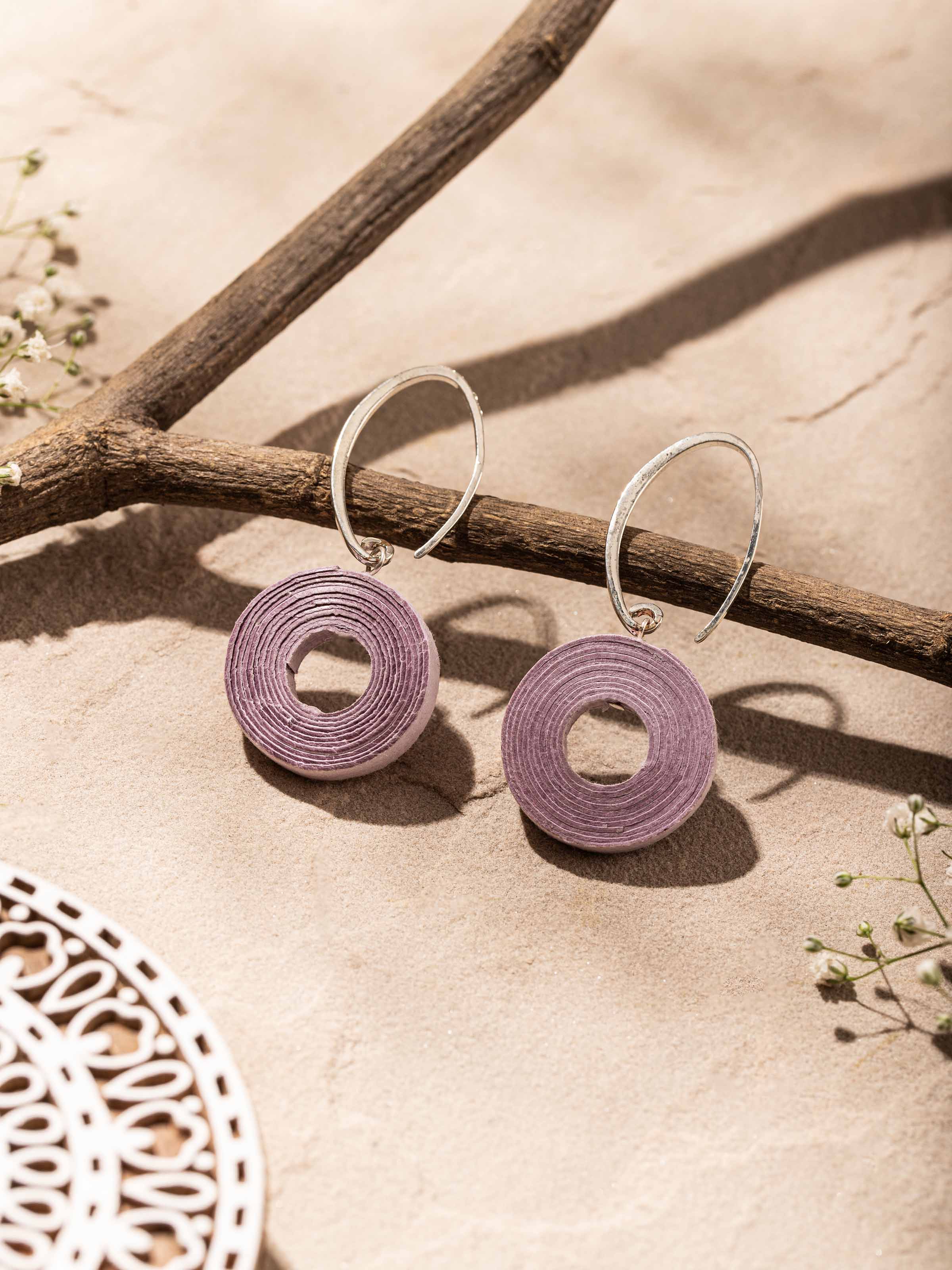 Side view of Paper Drop Earrings highlighting their intricate design and lightweight texture.