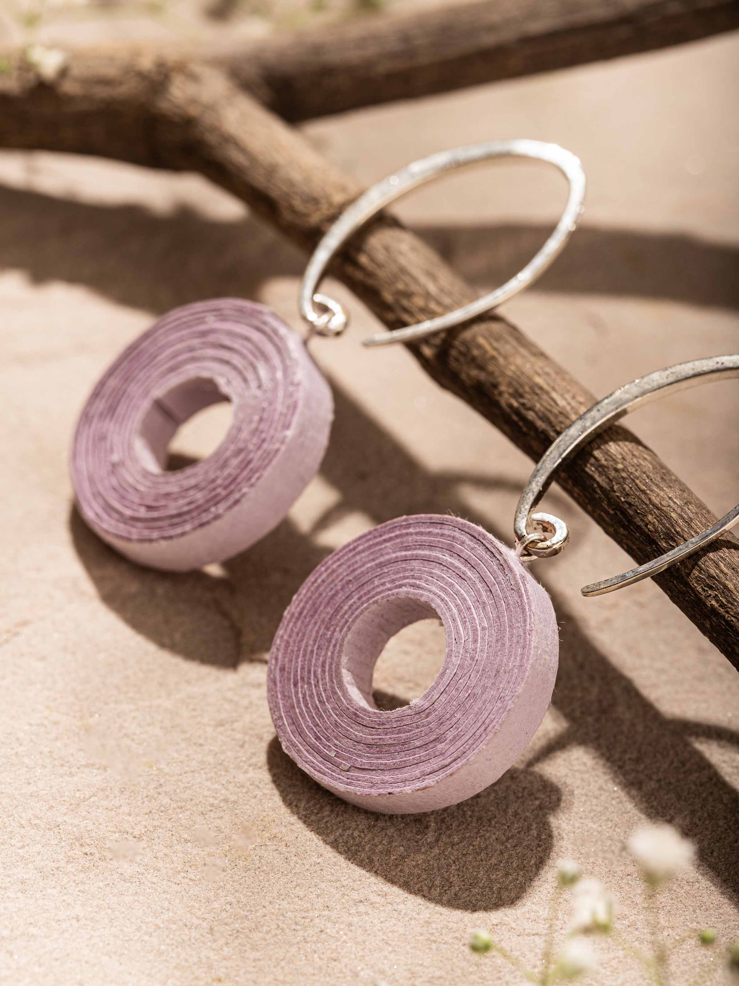 Detailed view of Paper Drop Earrings highlighting their refined paper texture and artistic design.