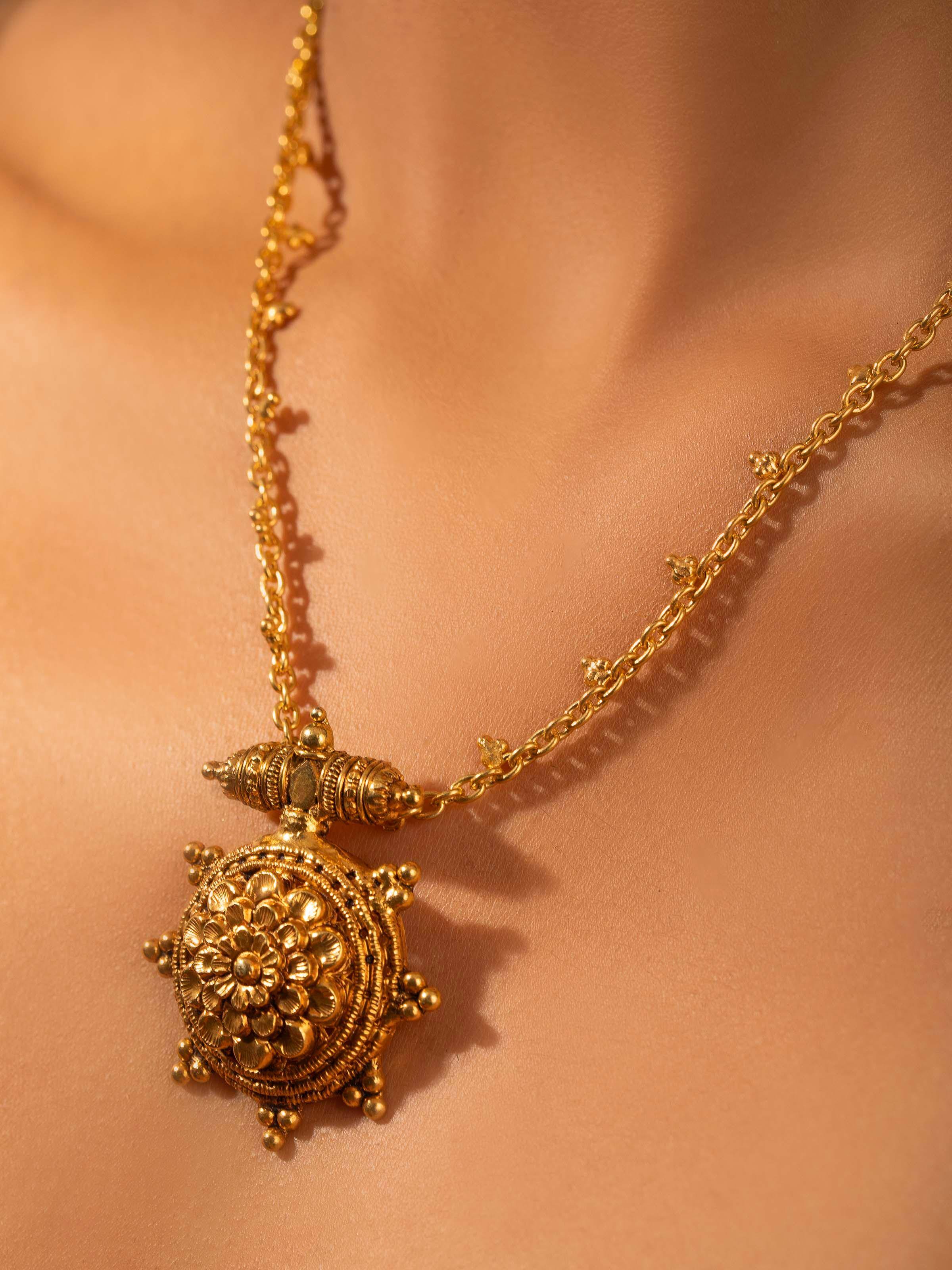 Close-up of Nakash silver collar necklace showing detailed silver metalwork and artistry.