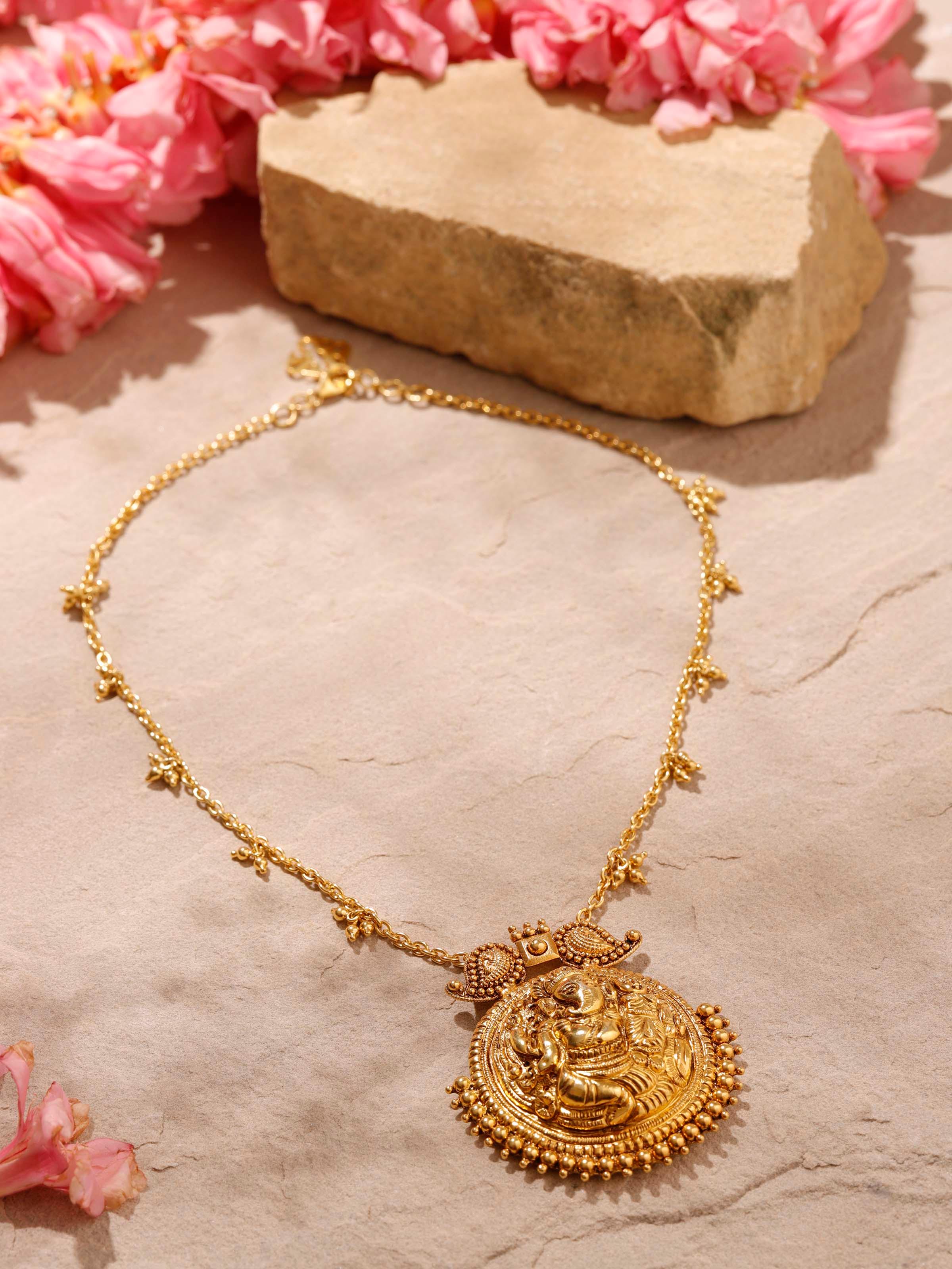 Detailed view of tribal silver long necklace emphasizing traditional design.