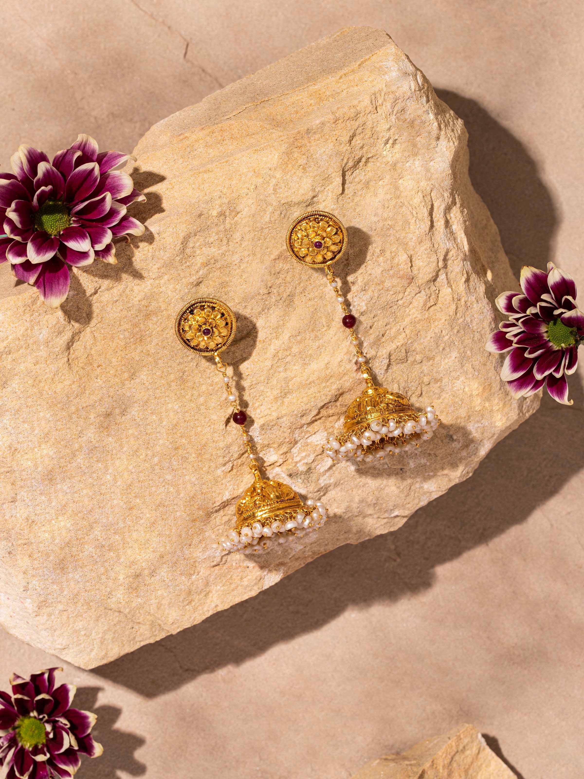 "Side view of Nakash silver jhumka earrings highlighting design elements"