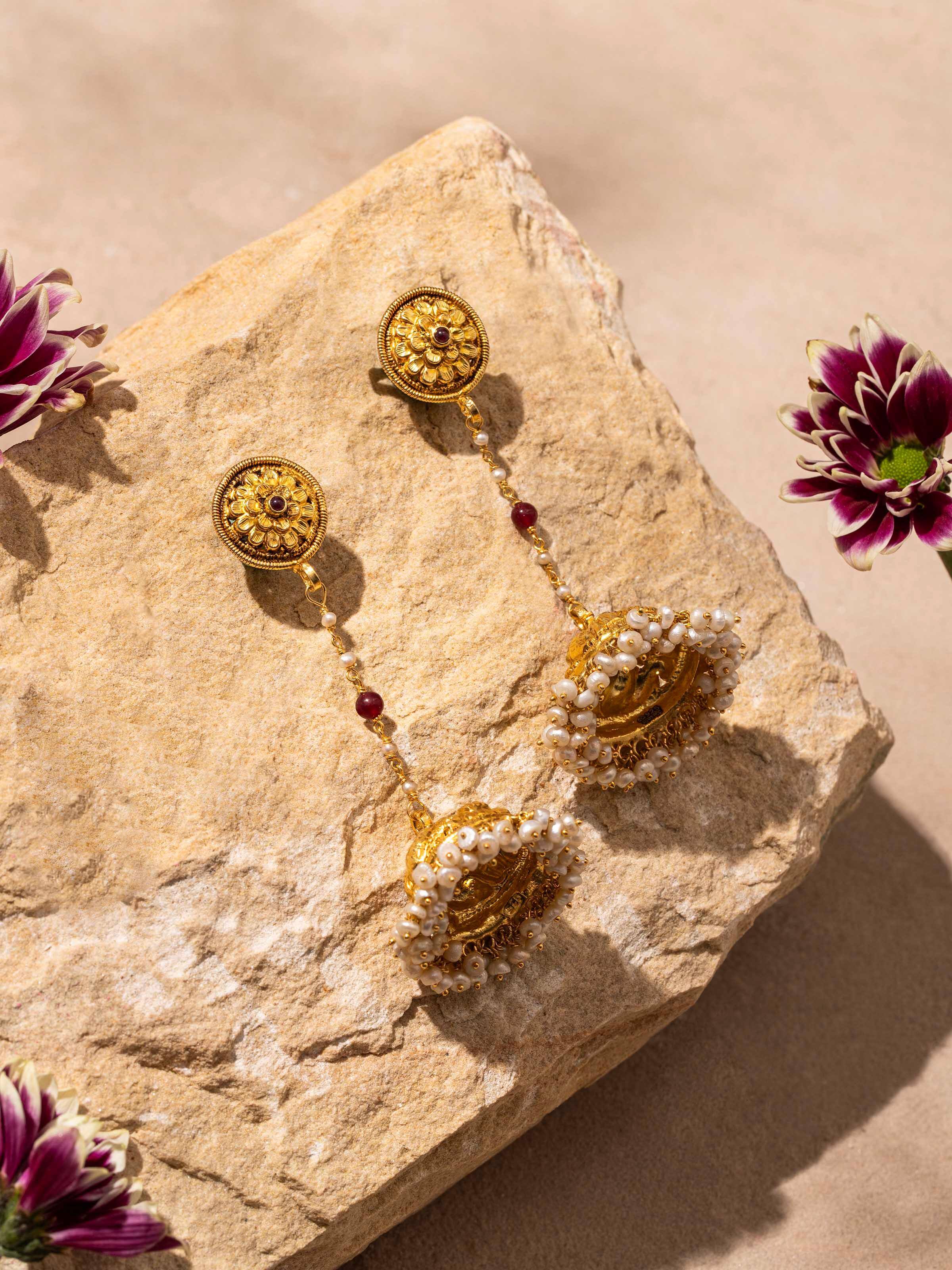 "Close-up of Nakash silver jhumka earrings showcasing detailed craftsmanship"