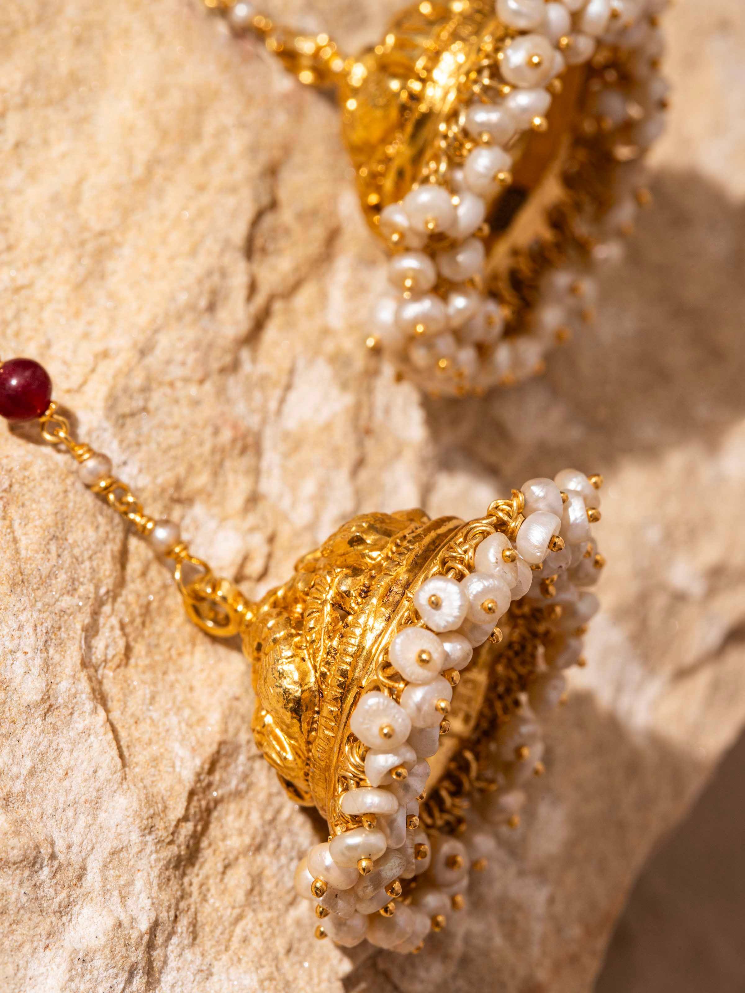 "Detailed view of Nakash silver jhumka earrings with focus on design details"