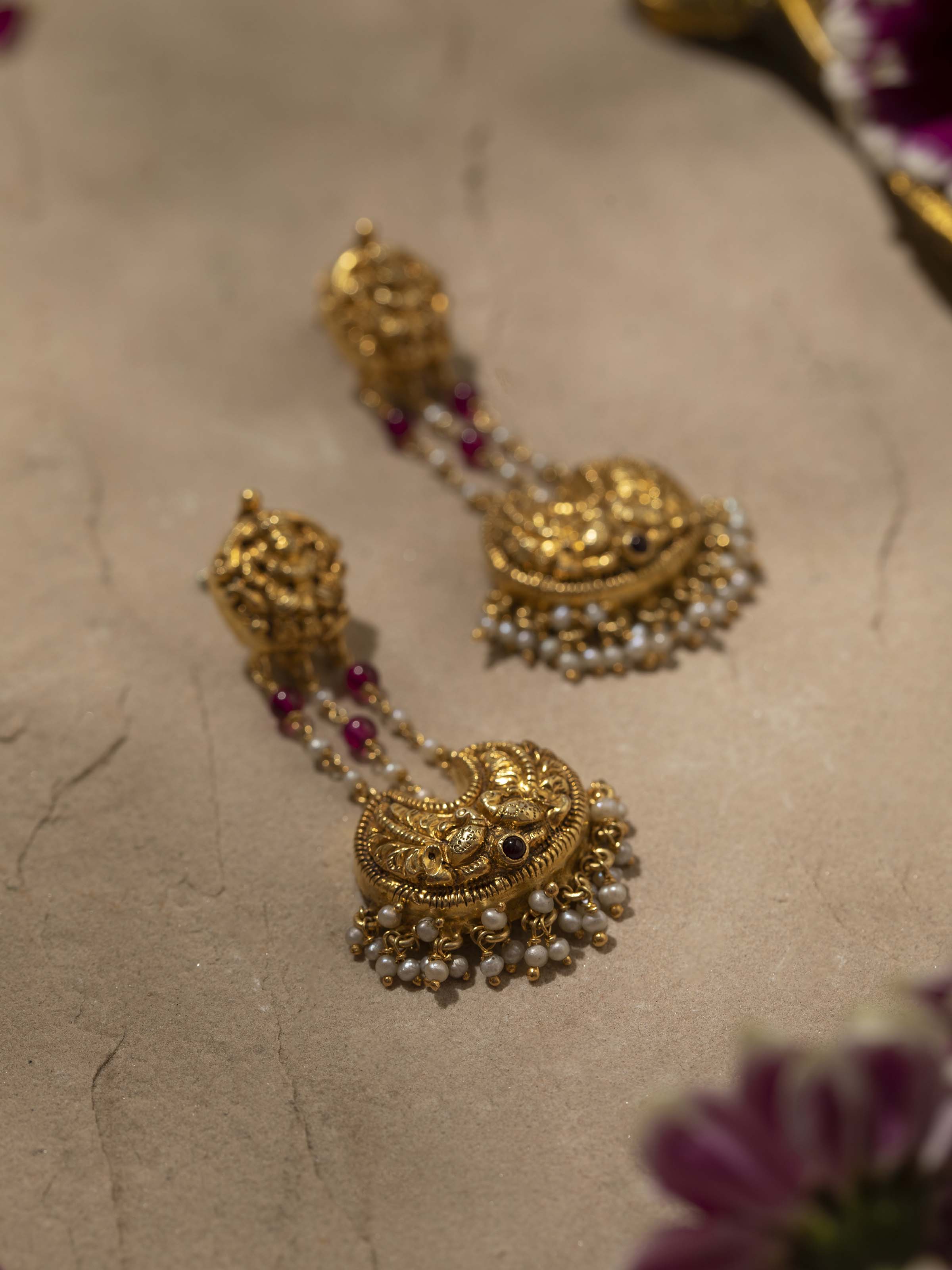 Overhead view of Nakash Silver Drop Earrings featuring intricate silver design and elegant drop style.