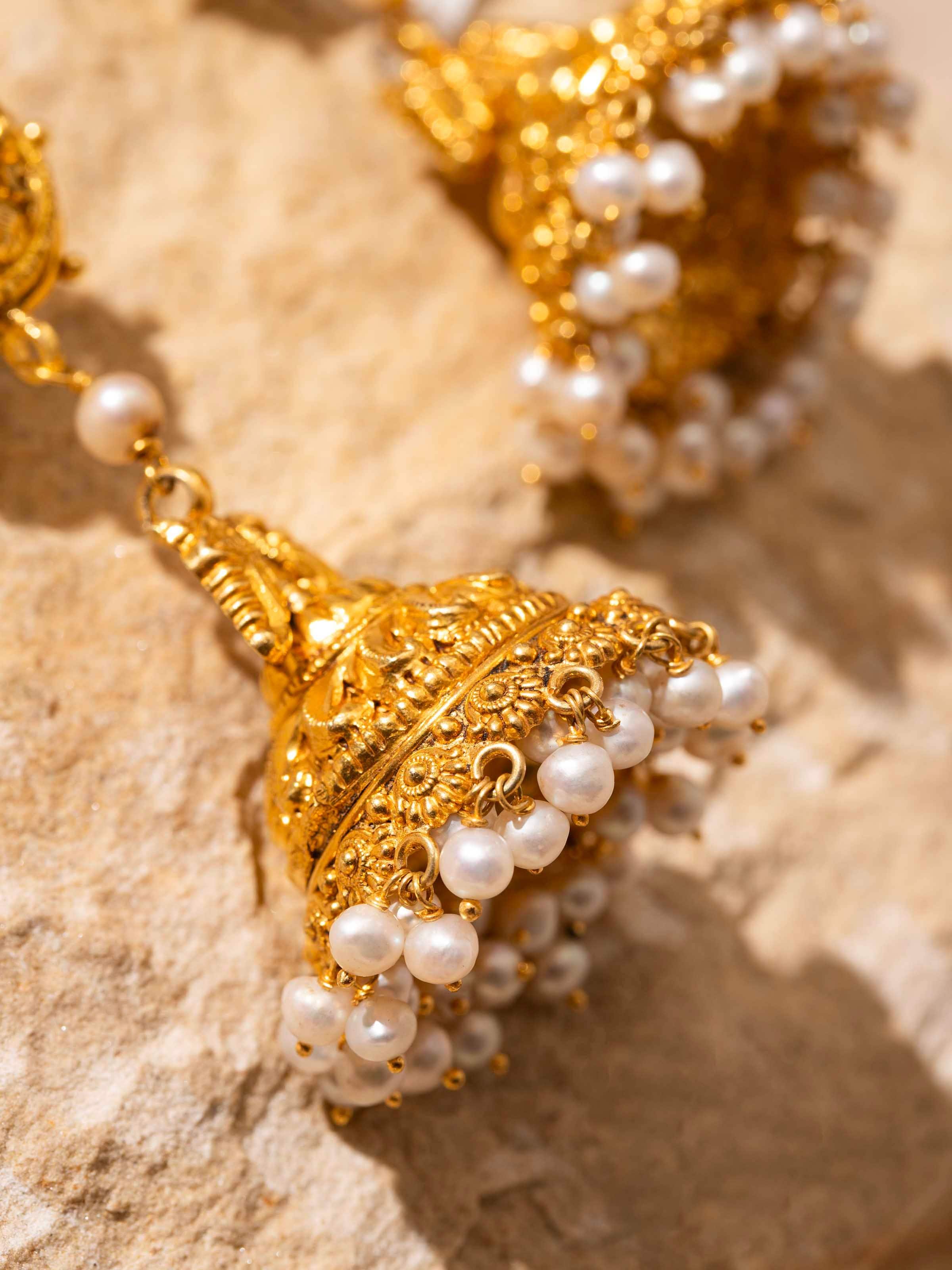 Detailed view of Nakash Silver Jhumka Earrings emphasizing the traditional design and silverwork.