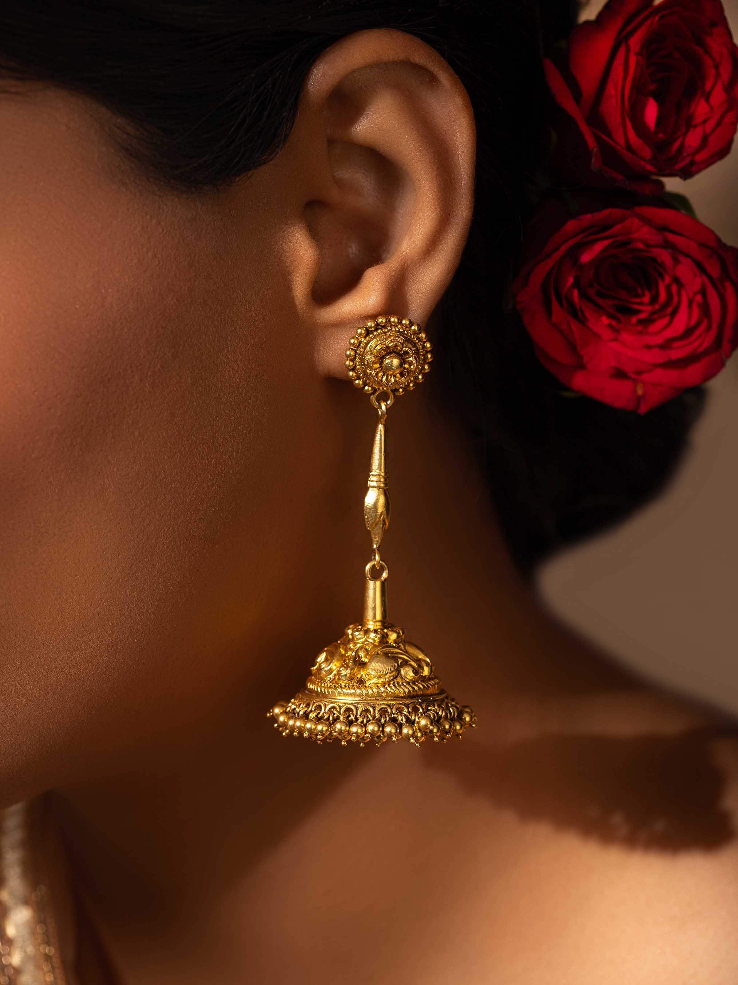 Side view of Nakash Silver Jhumkas displaying the elegant design and intricate silver detailing.