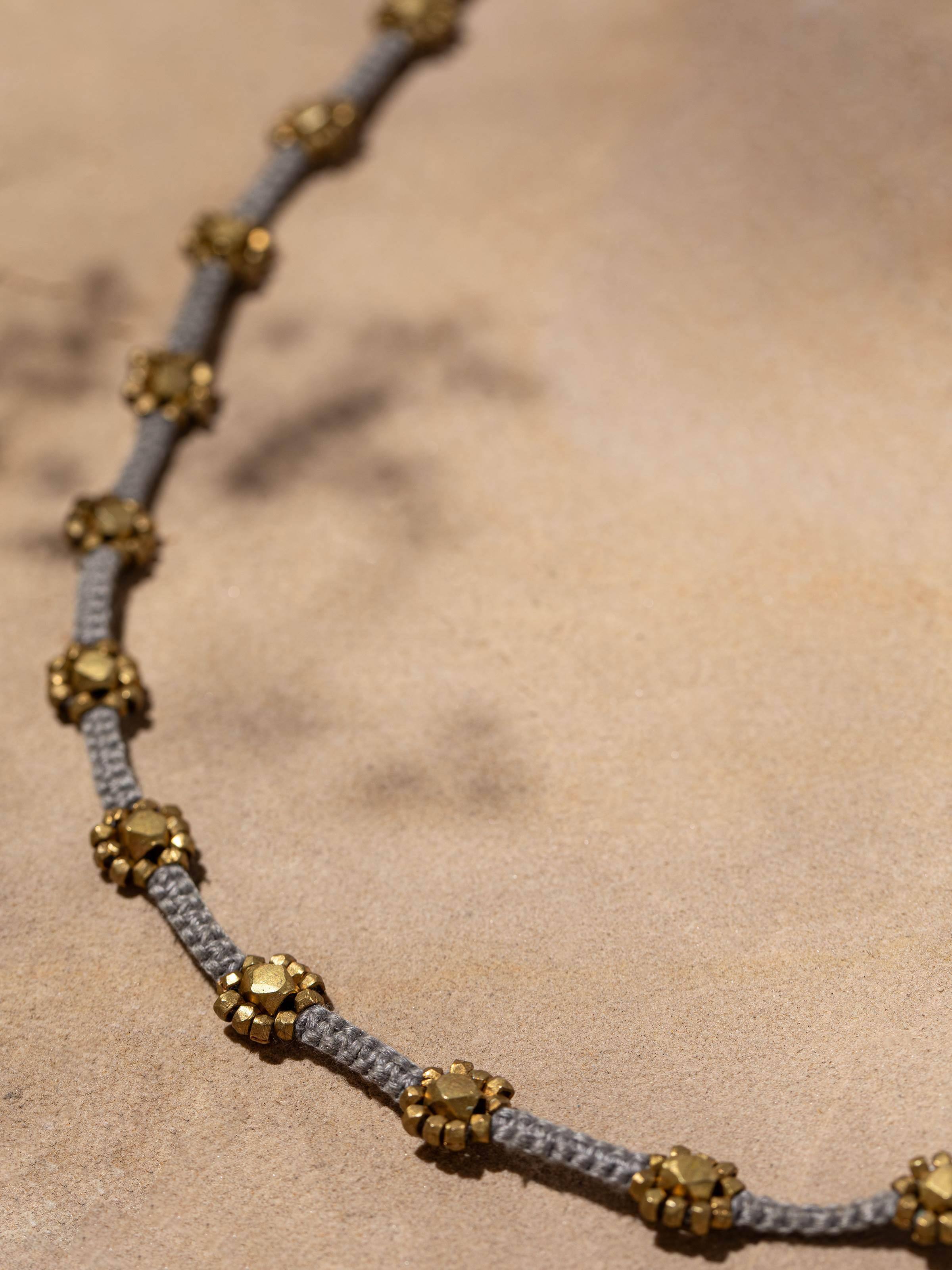 Overhead view of Dhokra Long Necklace highlighting the traditional Dhokra design and elegant arrangement.