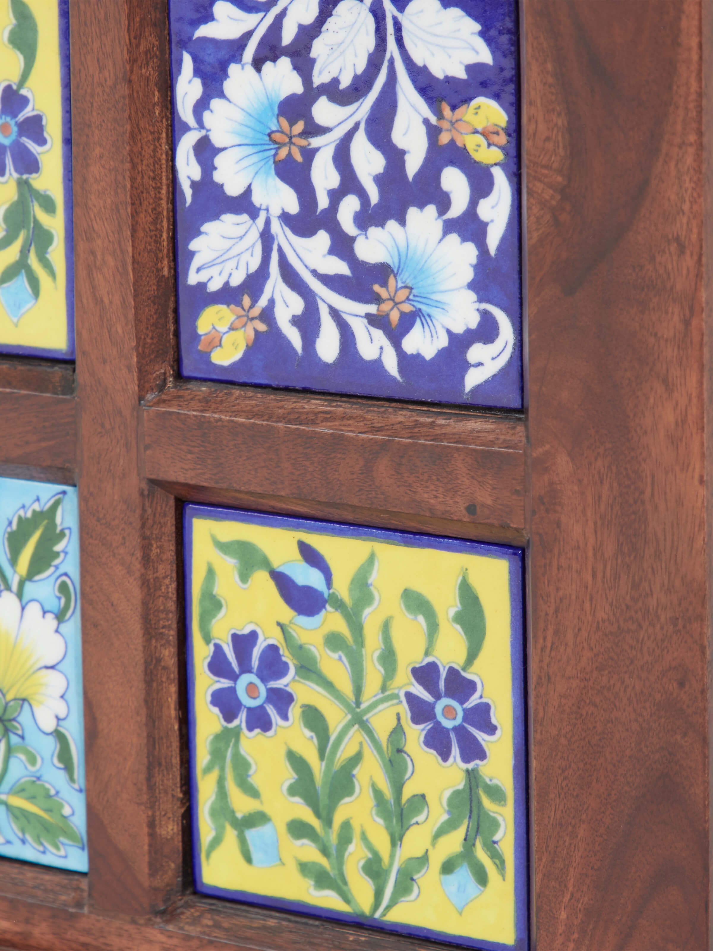 Sheesham wood trunk with blue pottery, showing the durability and elegant design suitable for traditional or modern interiors.