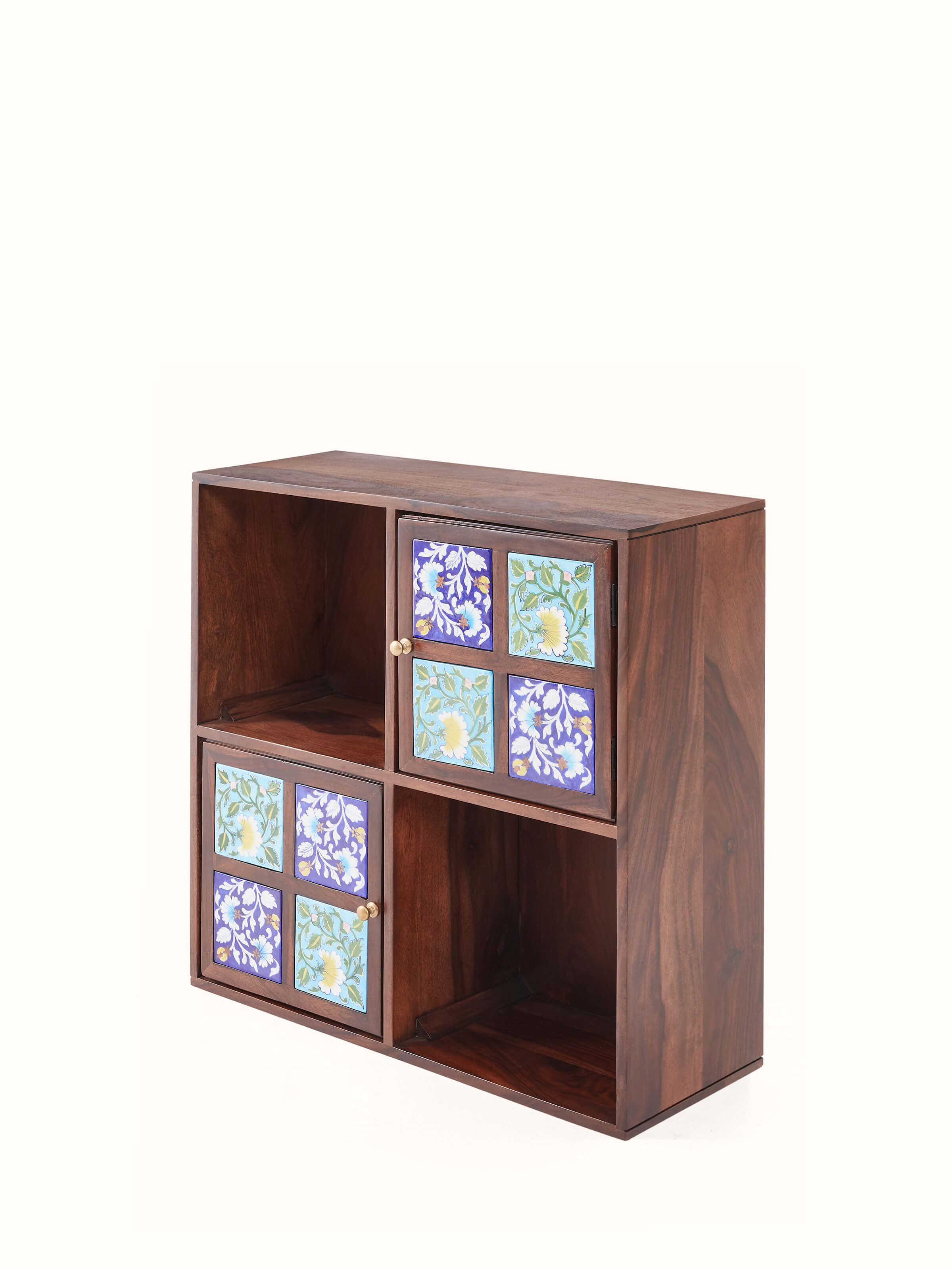 Angled view of Sheesham wood blue pottery wall shelf (2 doors) showing decorative features