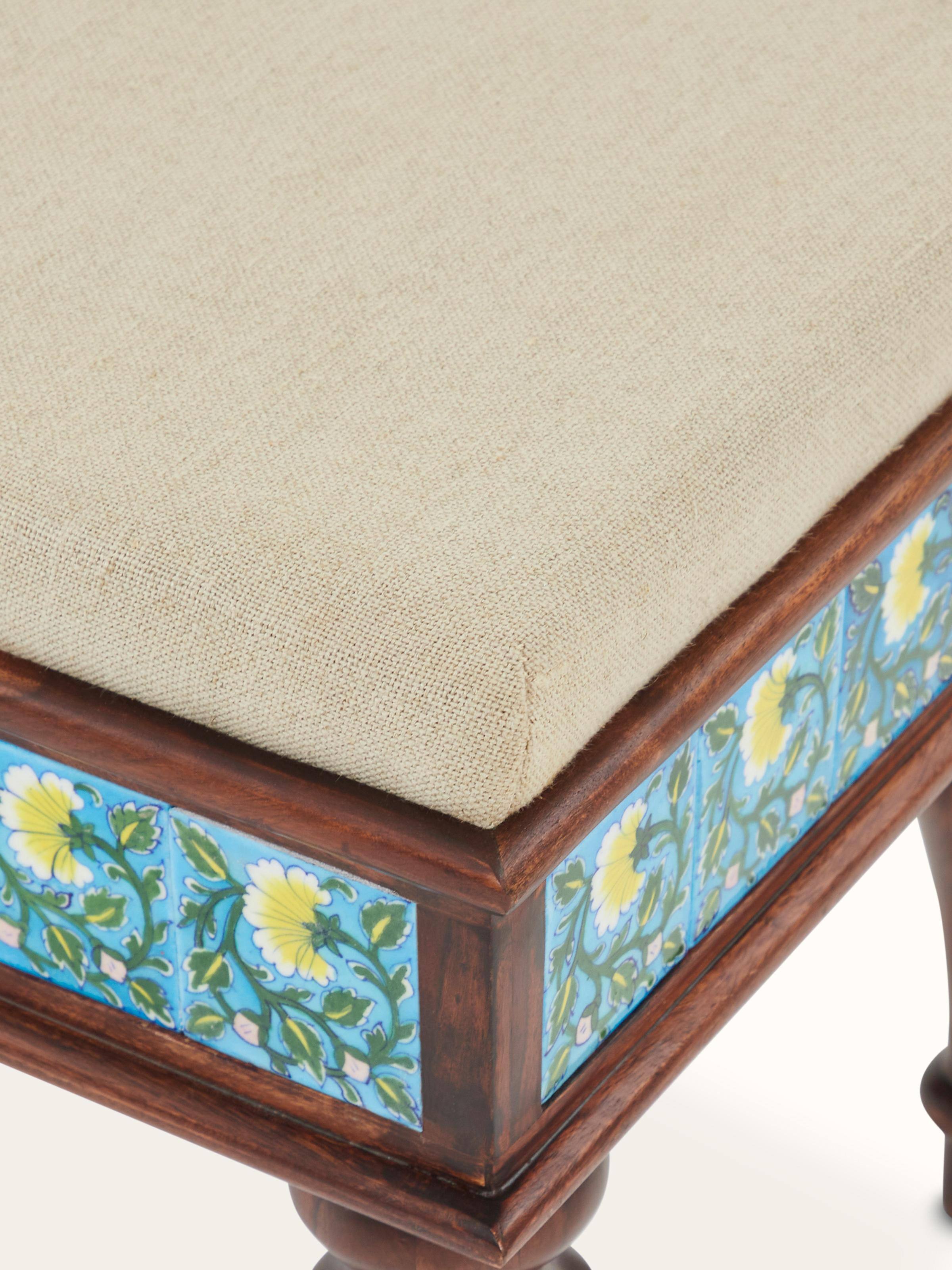 Back view of Sheesham wood blue pottery upholstered bench showing the upholstery design and wood finish
