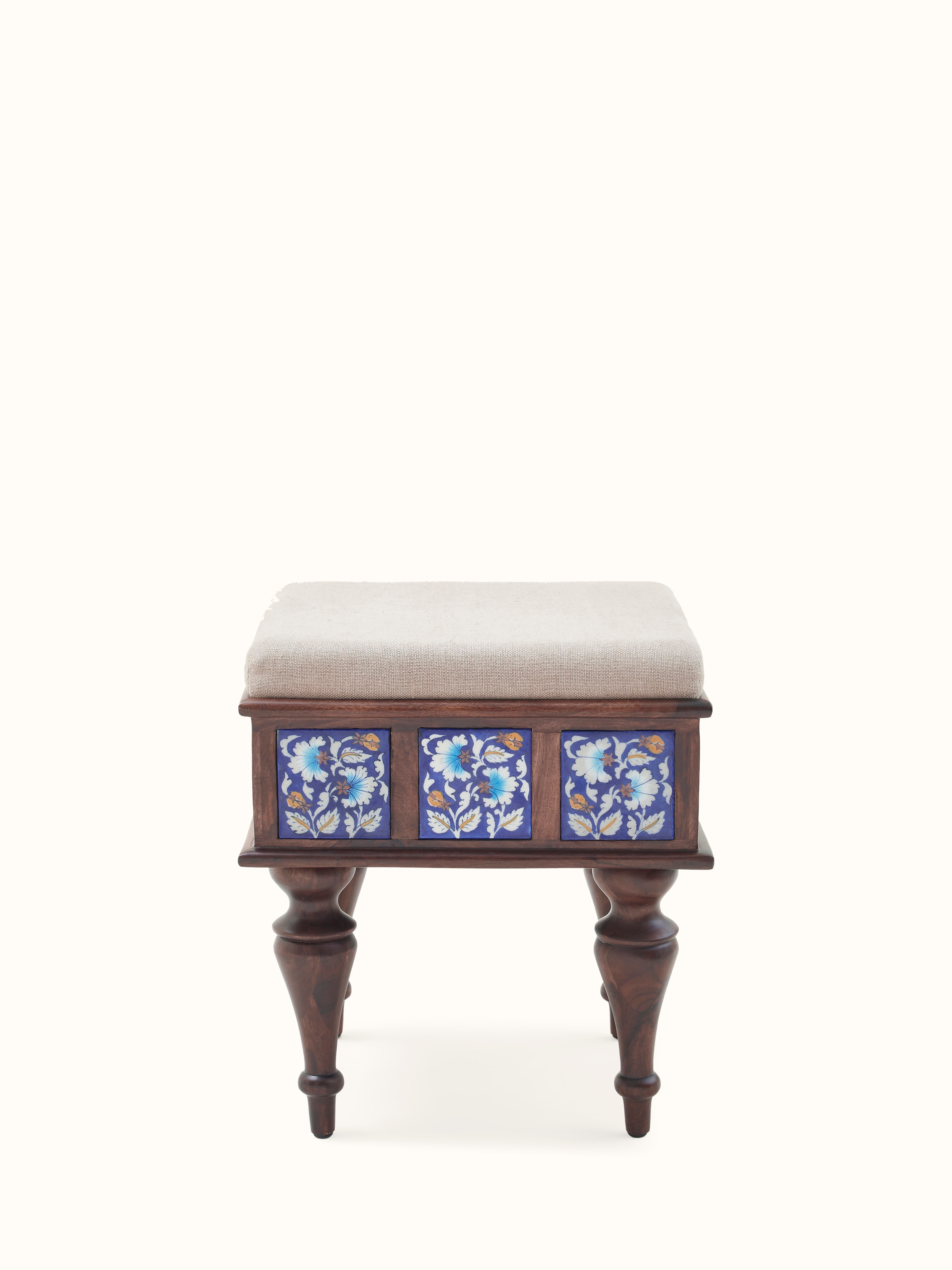 Front view of Sheesham wood blue pottery upholstered stool, featuring vibrant blue pottery design