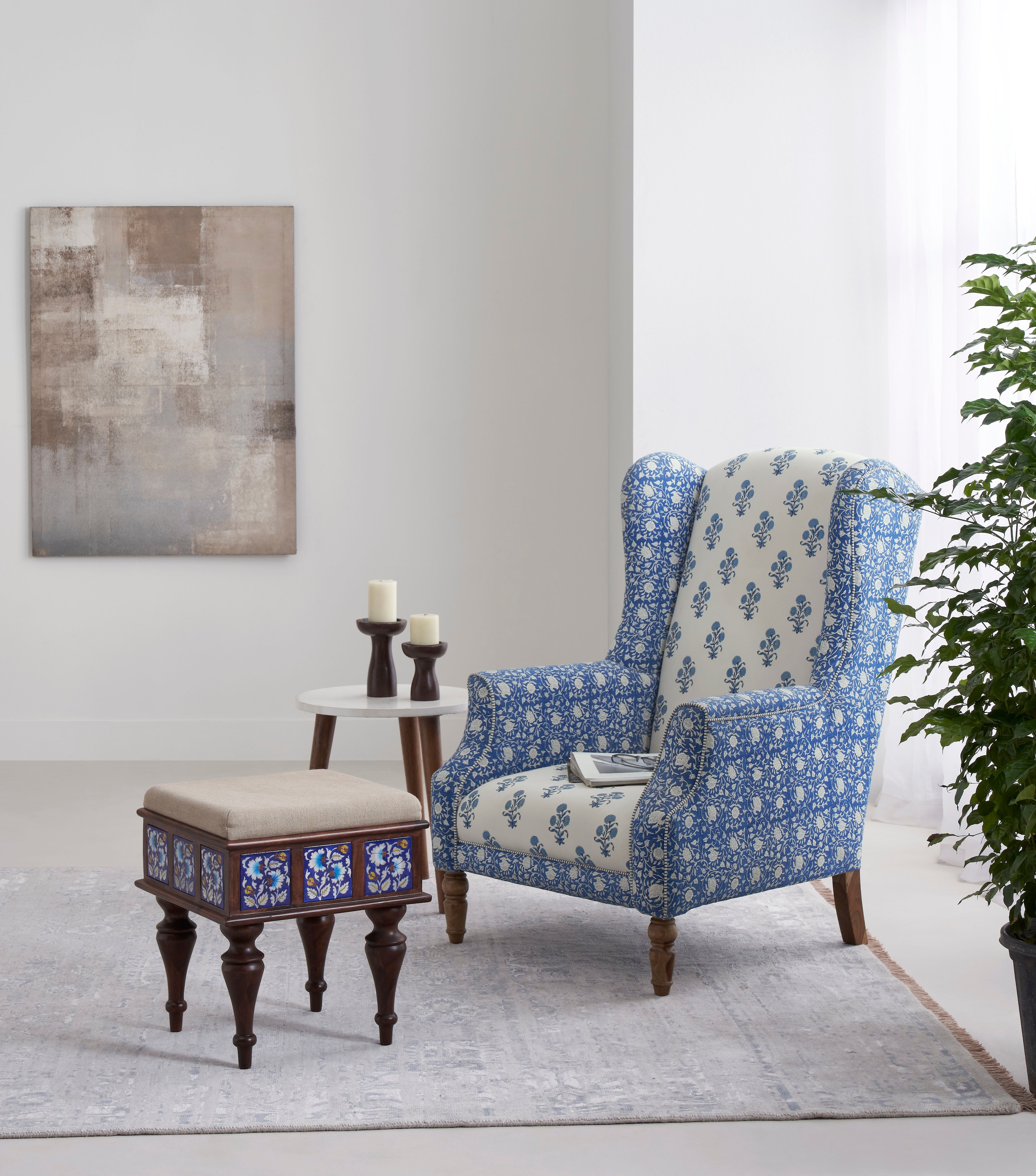Side view of Sheesham wood blue pottery upholstered stool, highlighting intricate wooden craftsmanship