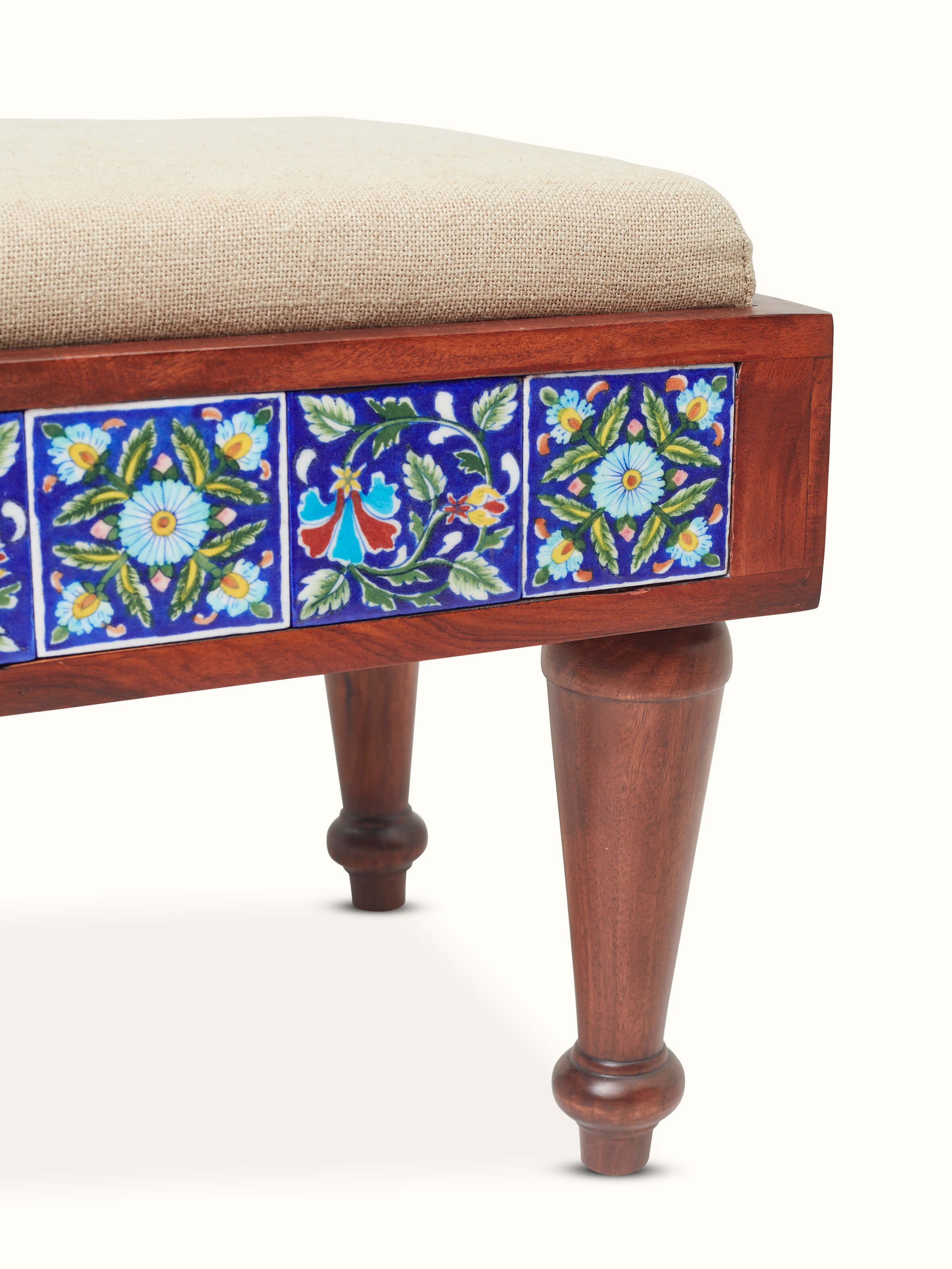 Side view of the coffee table set with Sheesham wood base and blue pottery, showing the table's elegant profile and craftsmanship.