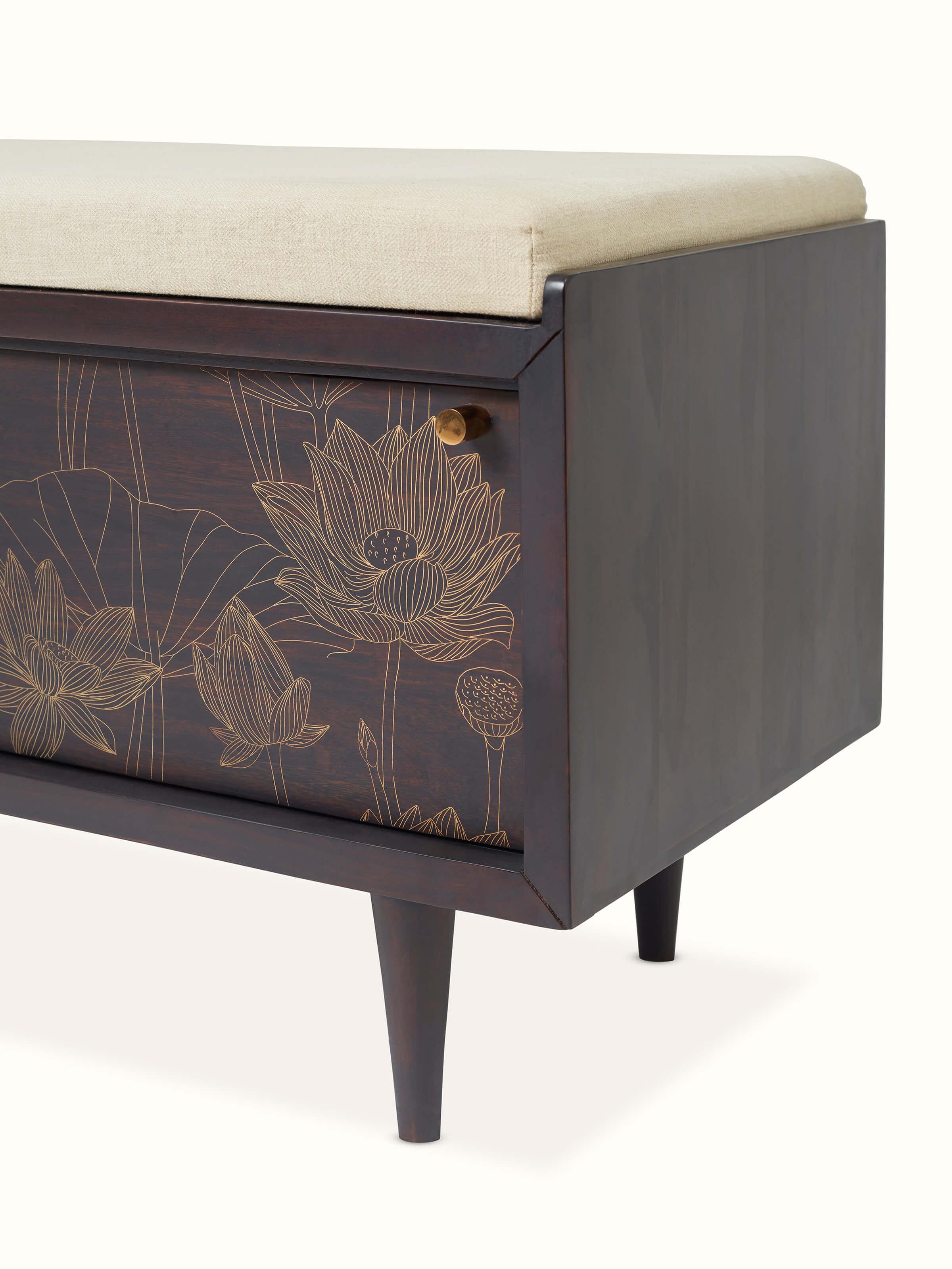Angled view of Sheesham wood and brass Tarkashi bench, showing the bench's profile and brass detailing.