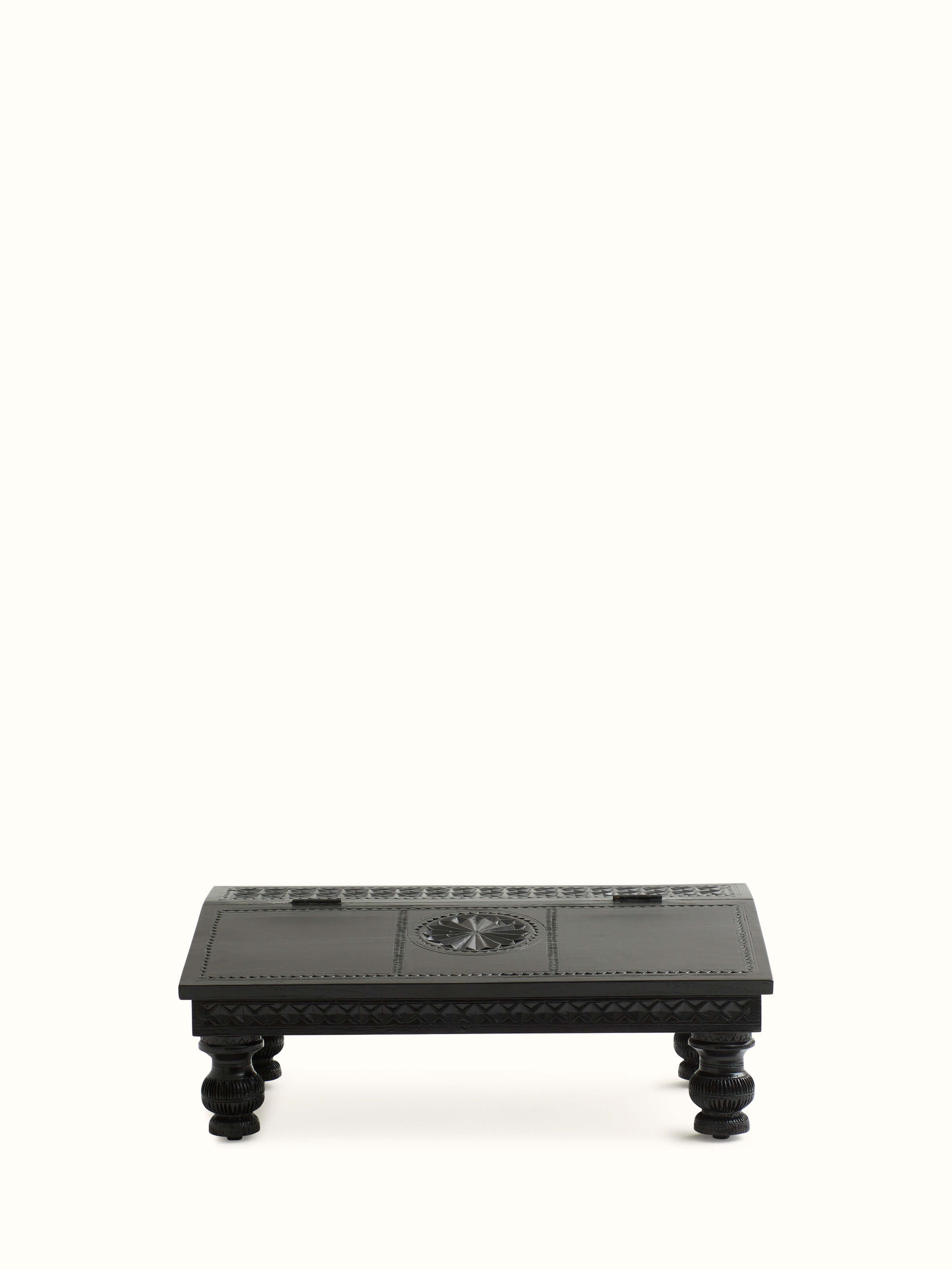 Front view of the carved teak wood portable table, highlighting intricate woodwork and elegant design.