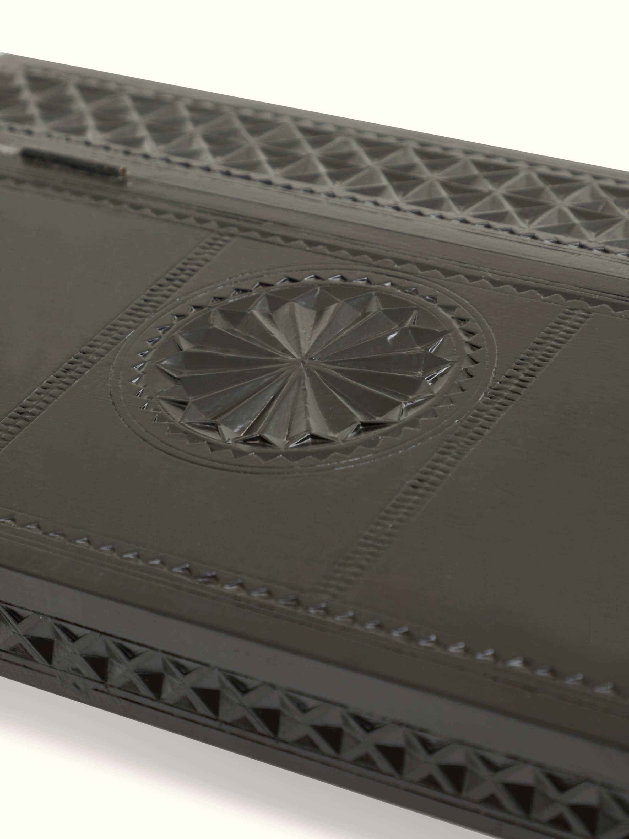 Detailed view of the table’s carvings and wood finish, highlighting its craftsmanship and quality.