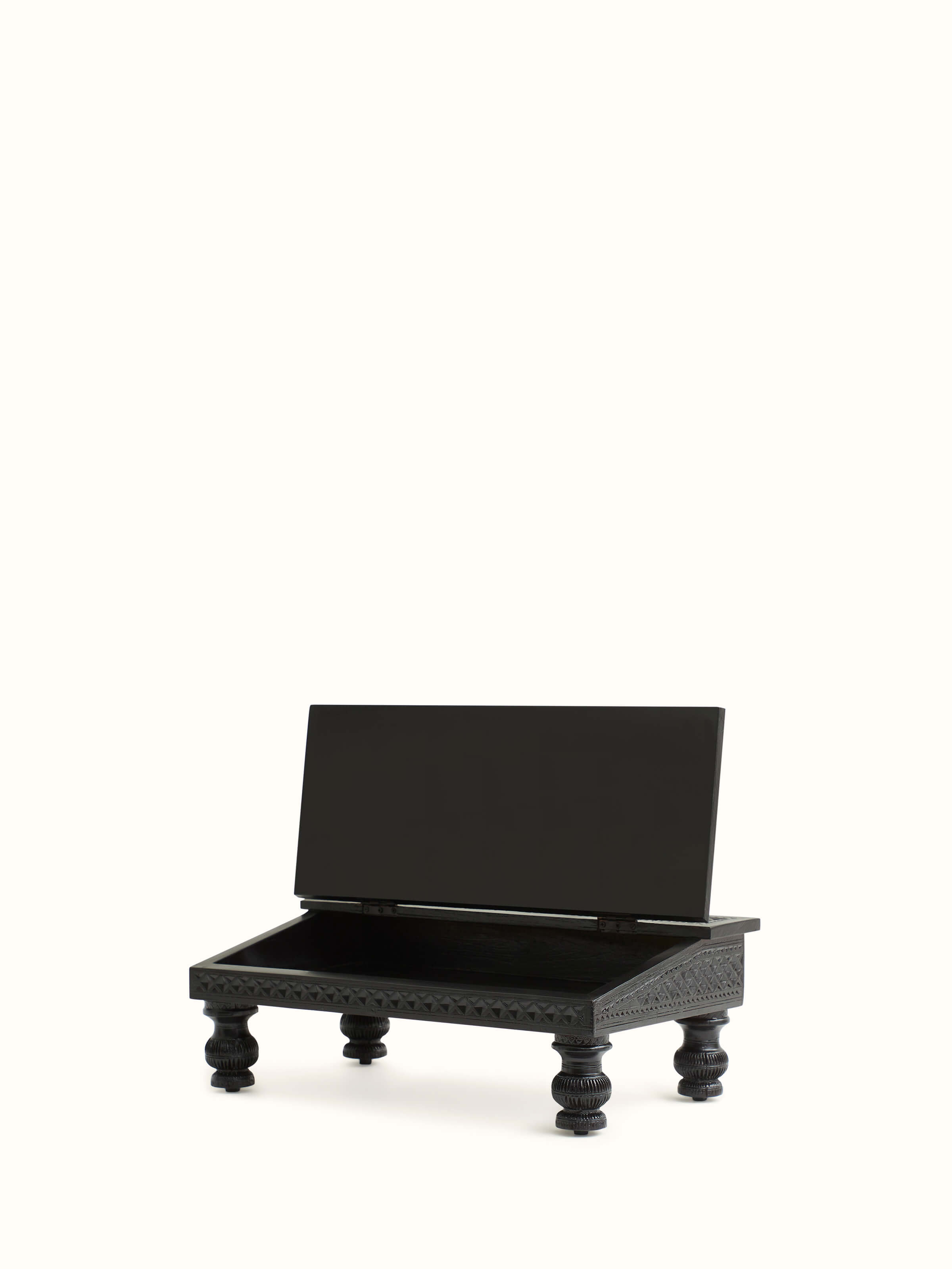 Side and detail view of the carved teak wood portable table, focusing on its intricate design and functional features.