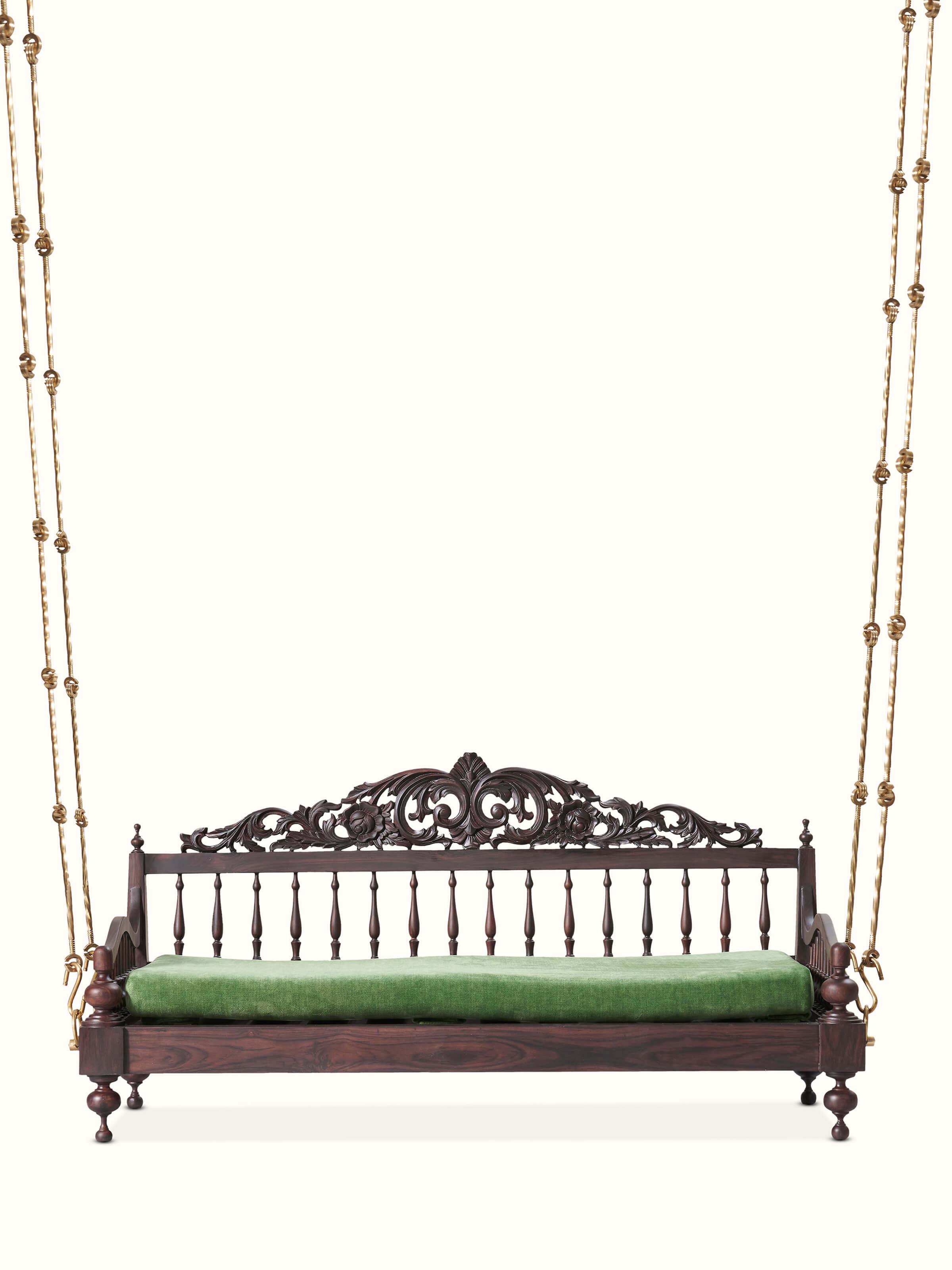 Front view of the carved rosewood swing, showcasing its intricate detailing and elegant design