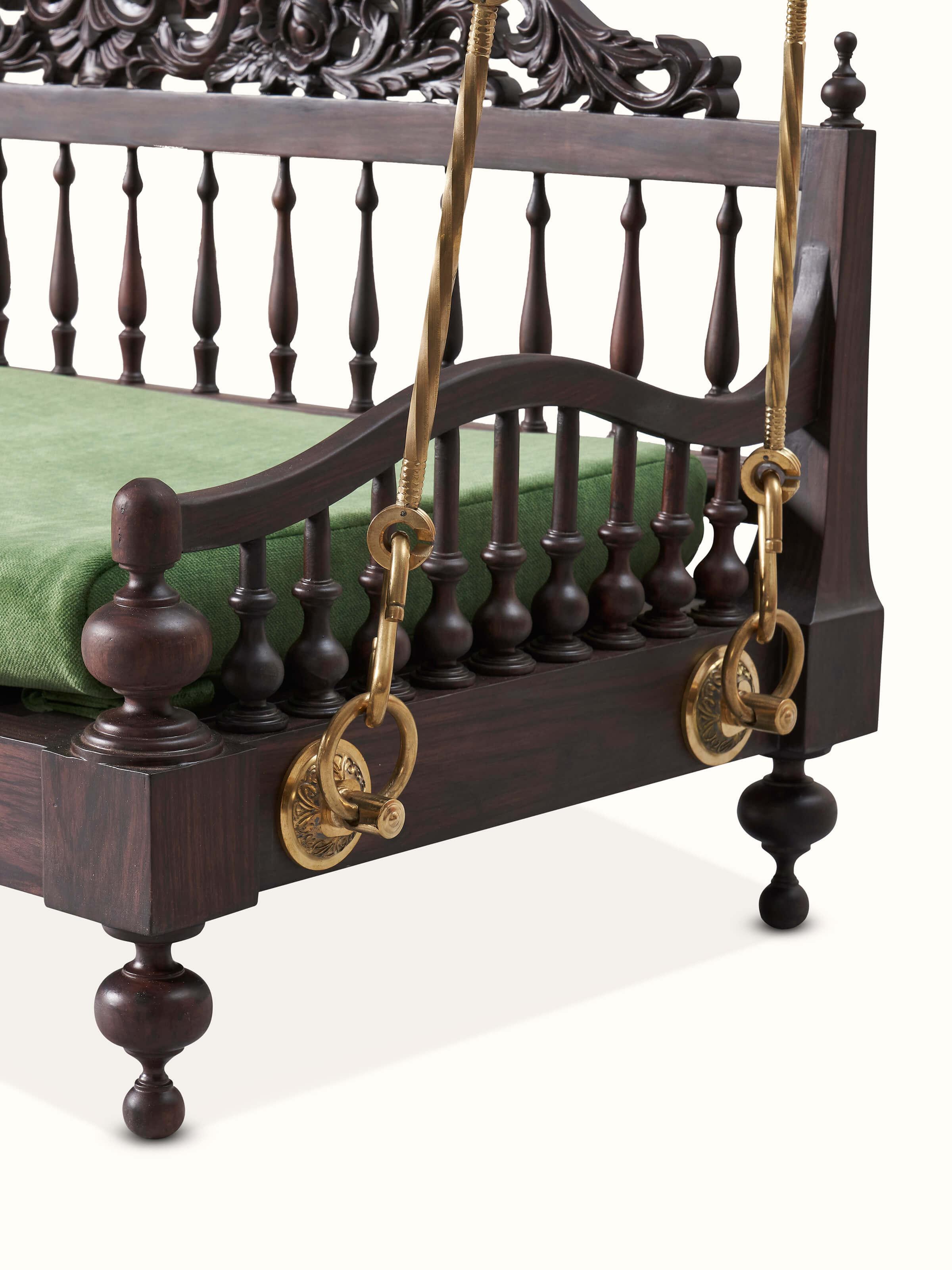 Detailed view of the swing's carvings, highlighting the intricate patterns and the fine finish of the rosewood