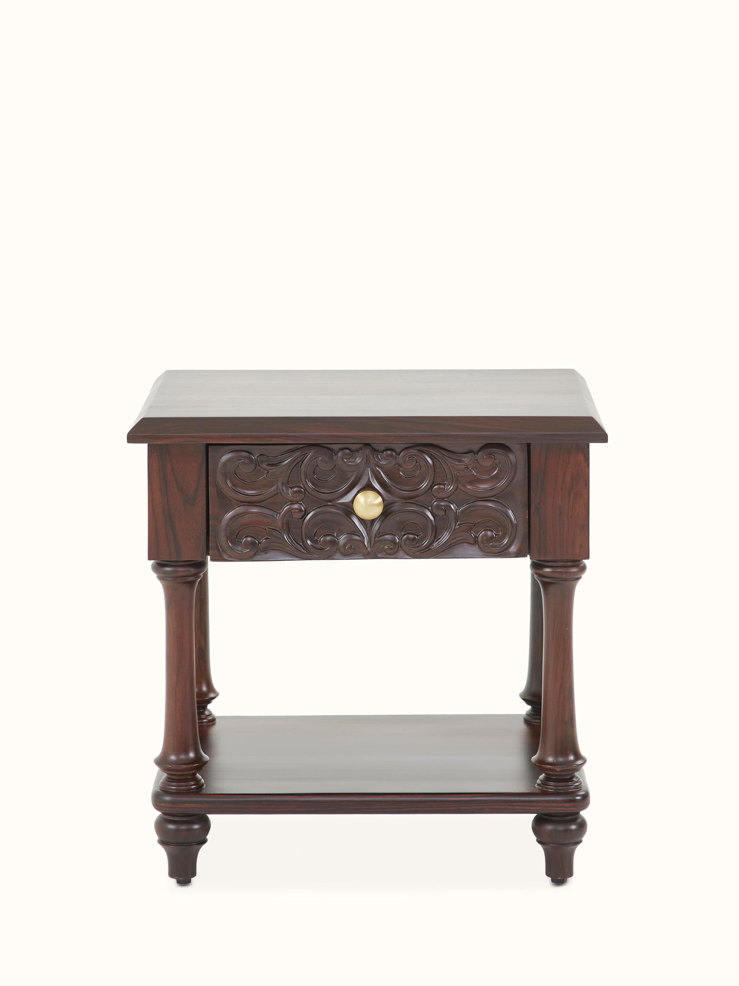 Front view of the carved rosewood bedside table, showcasing its intricate woodwork and elegant design.