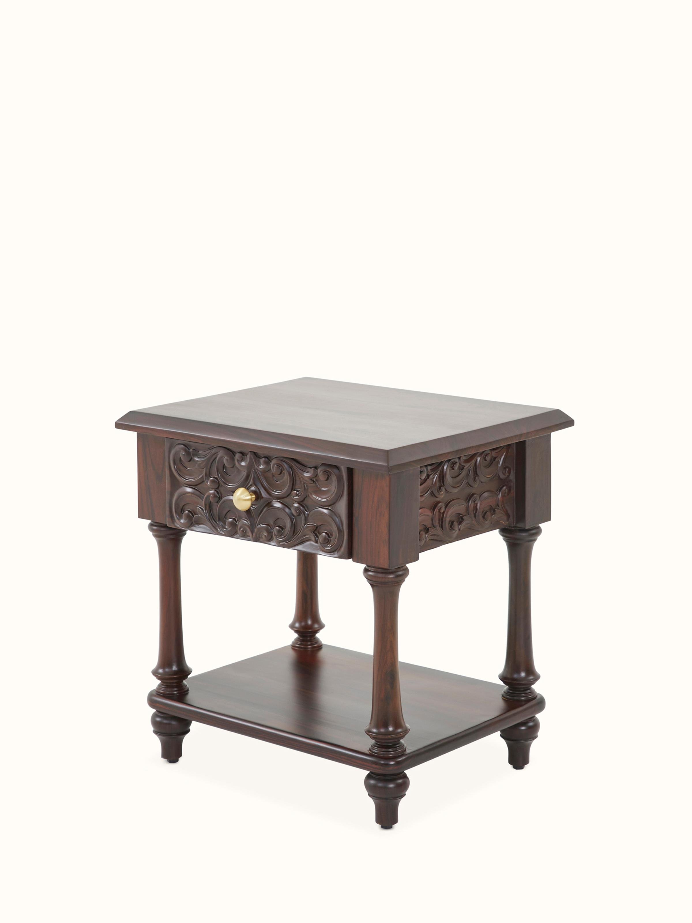 Top view of the carved rosewood bedside table, focusing on the surface and the detailed carvings.