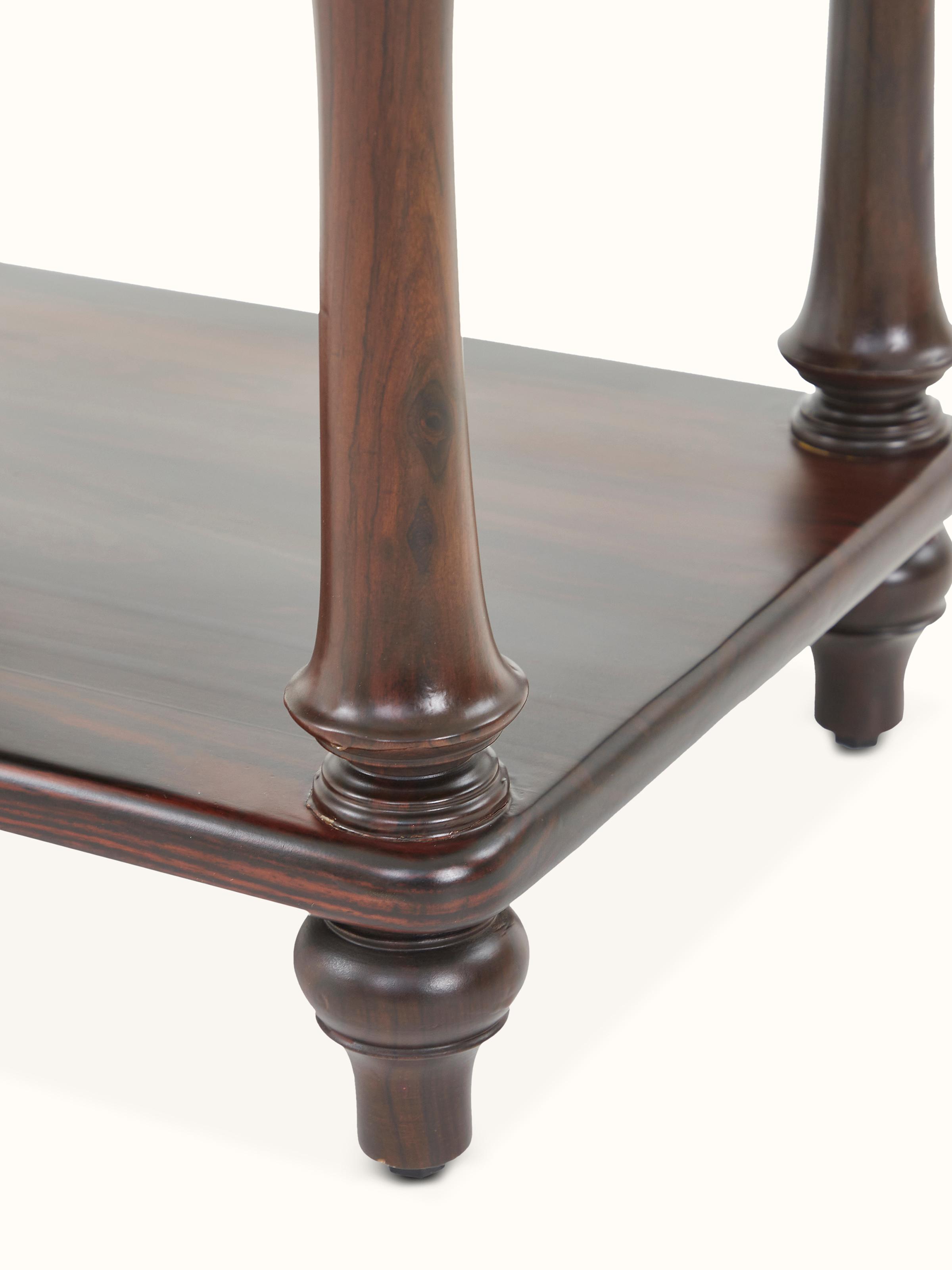 Close-up of the rosewood detailing on the bedside table, highlighting the intricate patterns and texture.