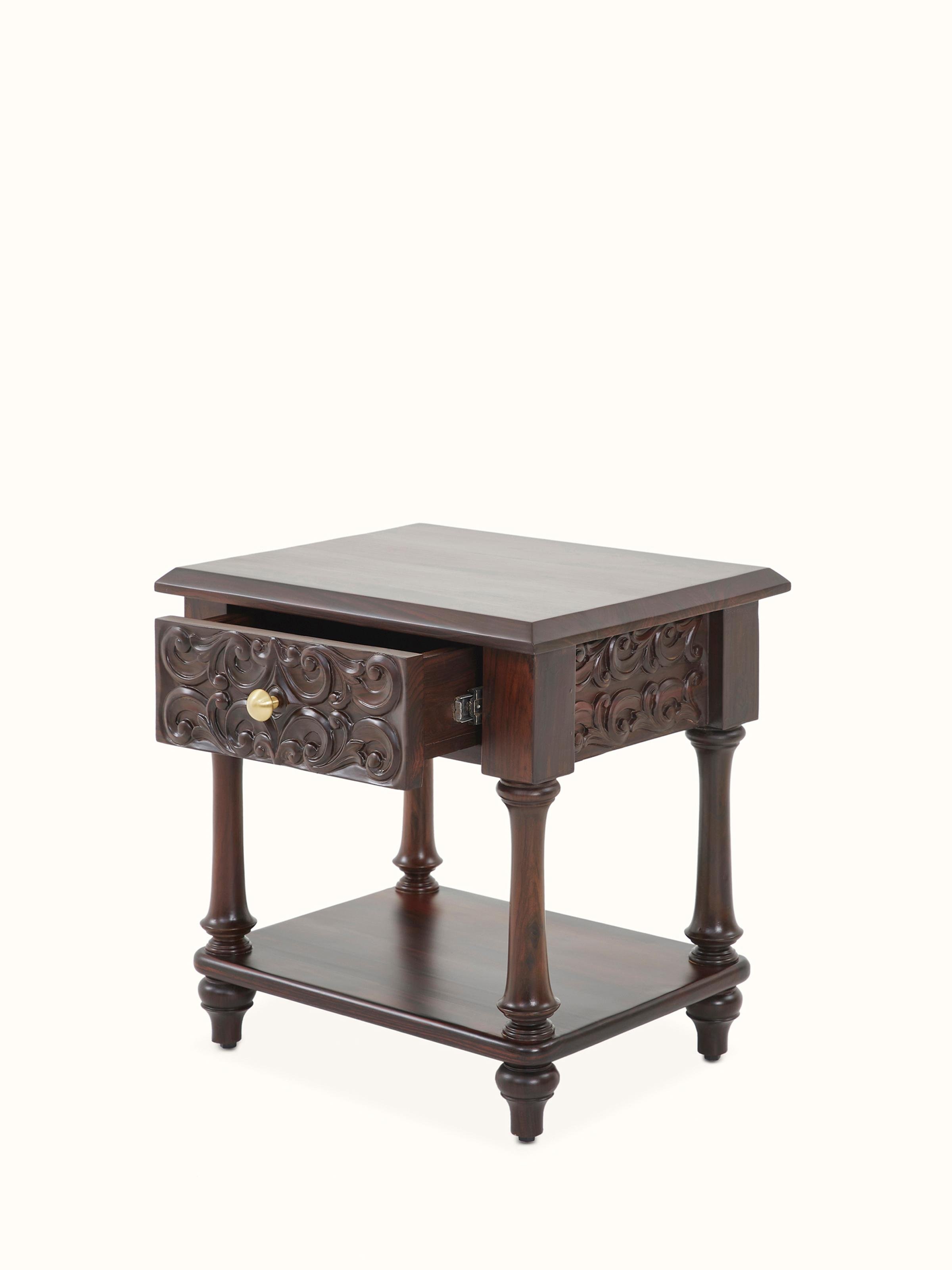 Detailed view of the carved rosewood bedside table, showing the craftsmanship and natural finish.