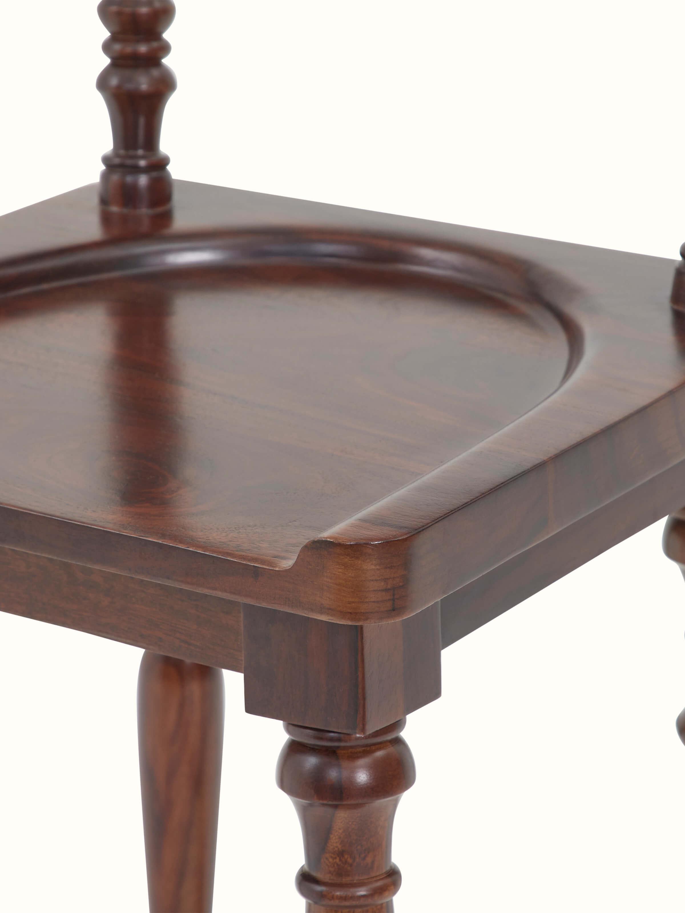 Detail view of Sheesham wood bar stool legs, illustrating the elegant design and durability.