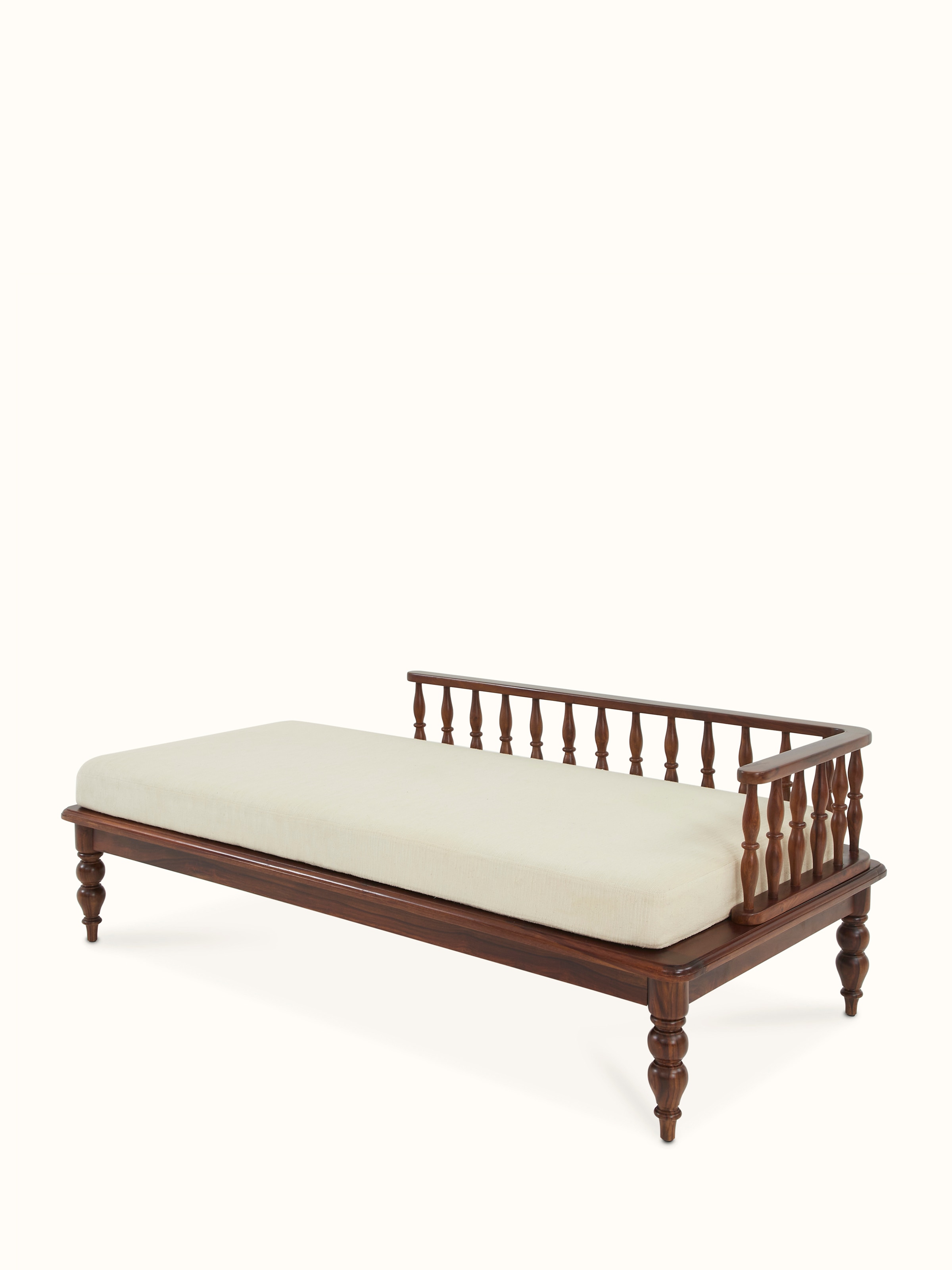 Angle view of Teak finish upholstered Sheesham wood daybed, featuring the stylish design and detailed woodwork