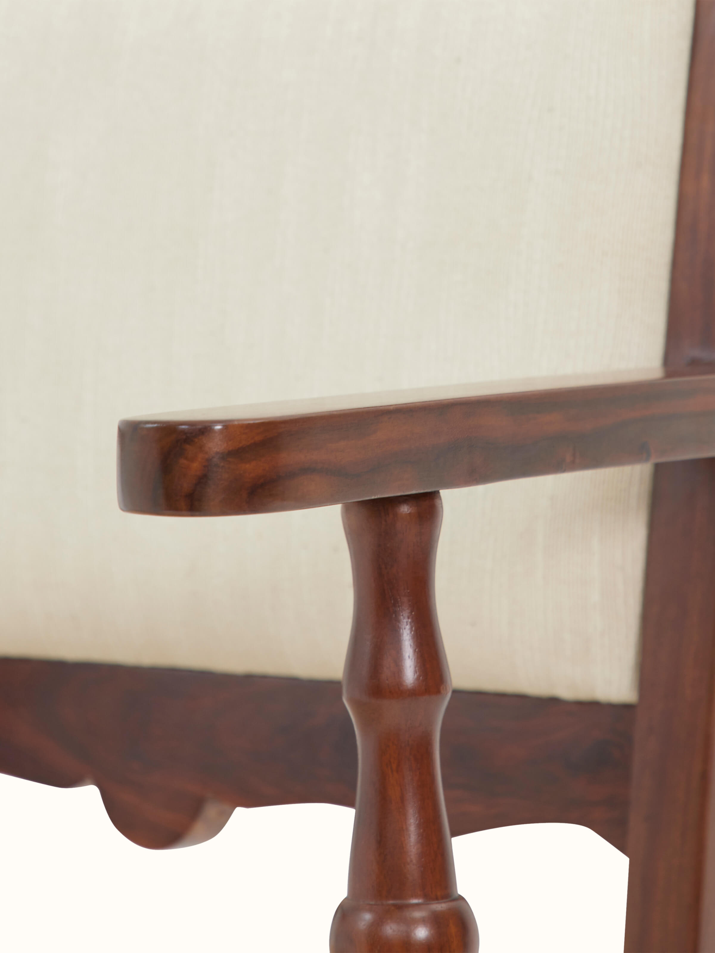 View of the upholstered Sheesham wood study chair from an angle, showing the design and upholstery