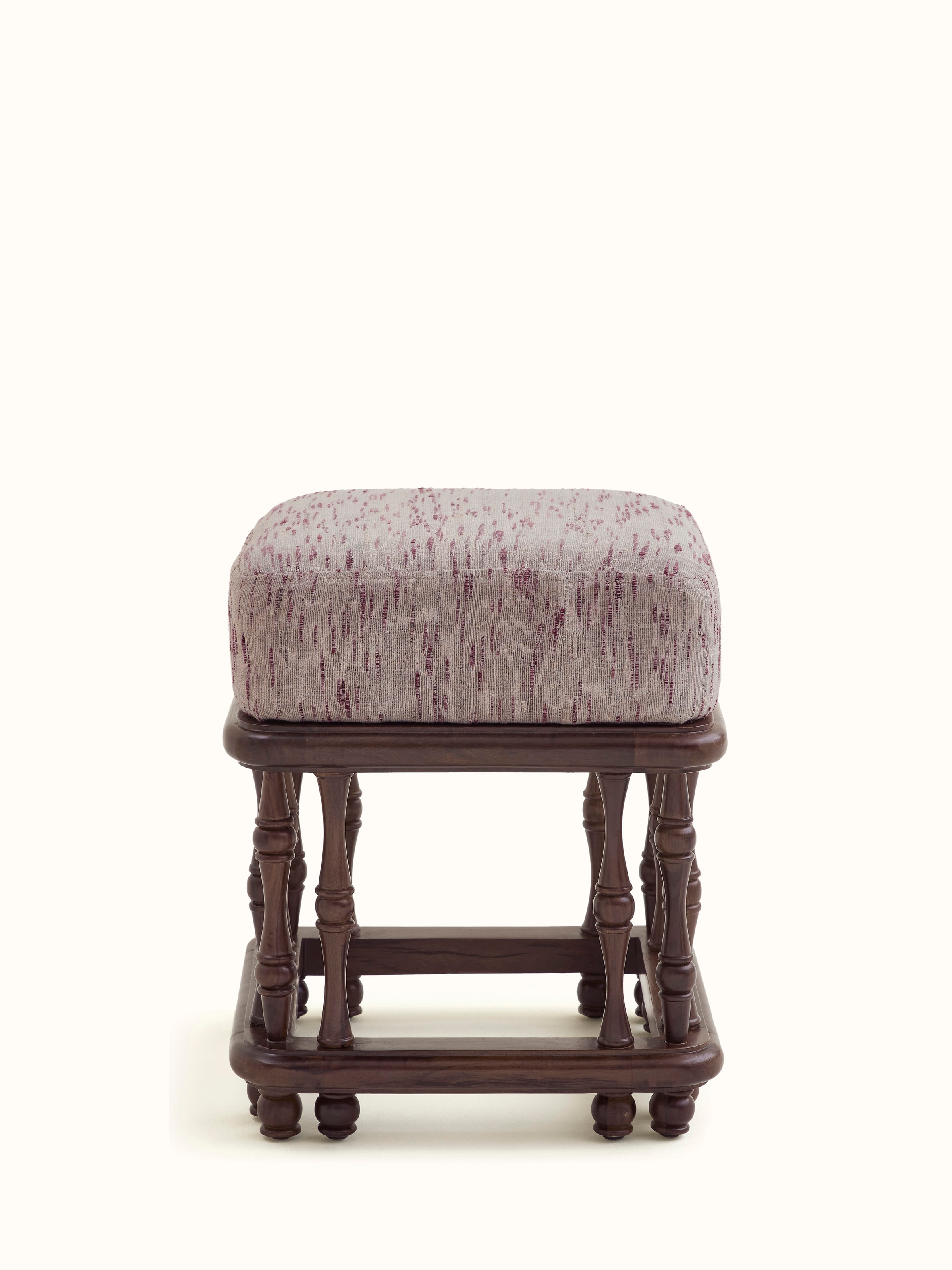 Front view of the upholstered Sheesham wood ottoman, showcasing its elegant design and plush cushioning.