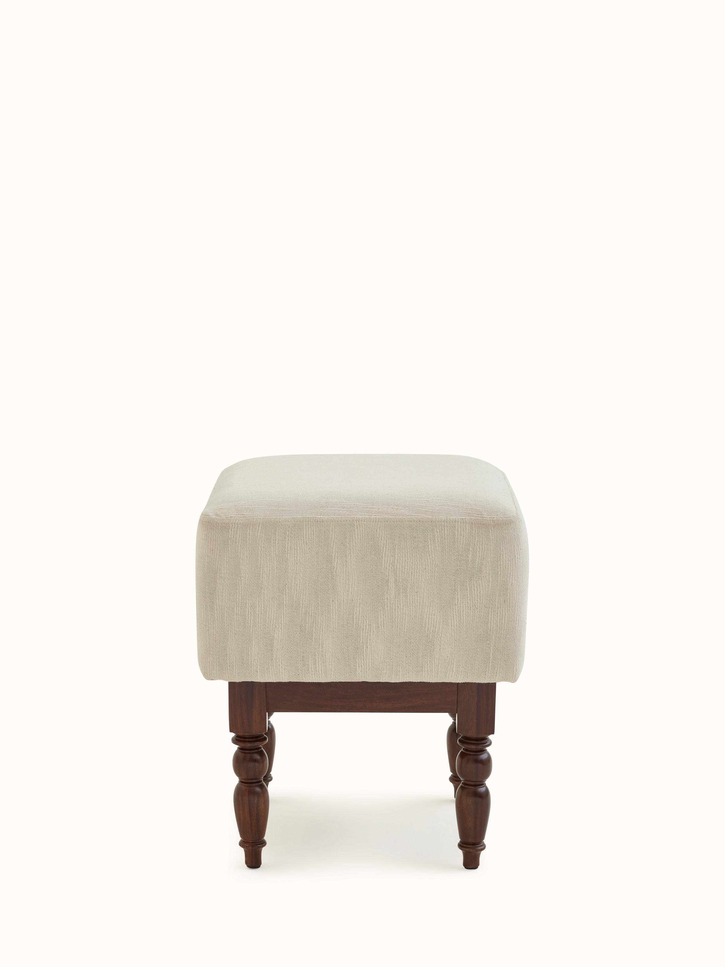 Front view of the upholstered Sheesham wood octagonal ottoman, showing its elegant design and plush fabric.