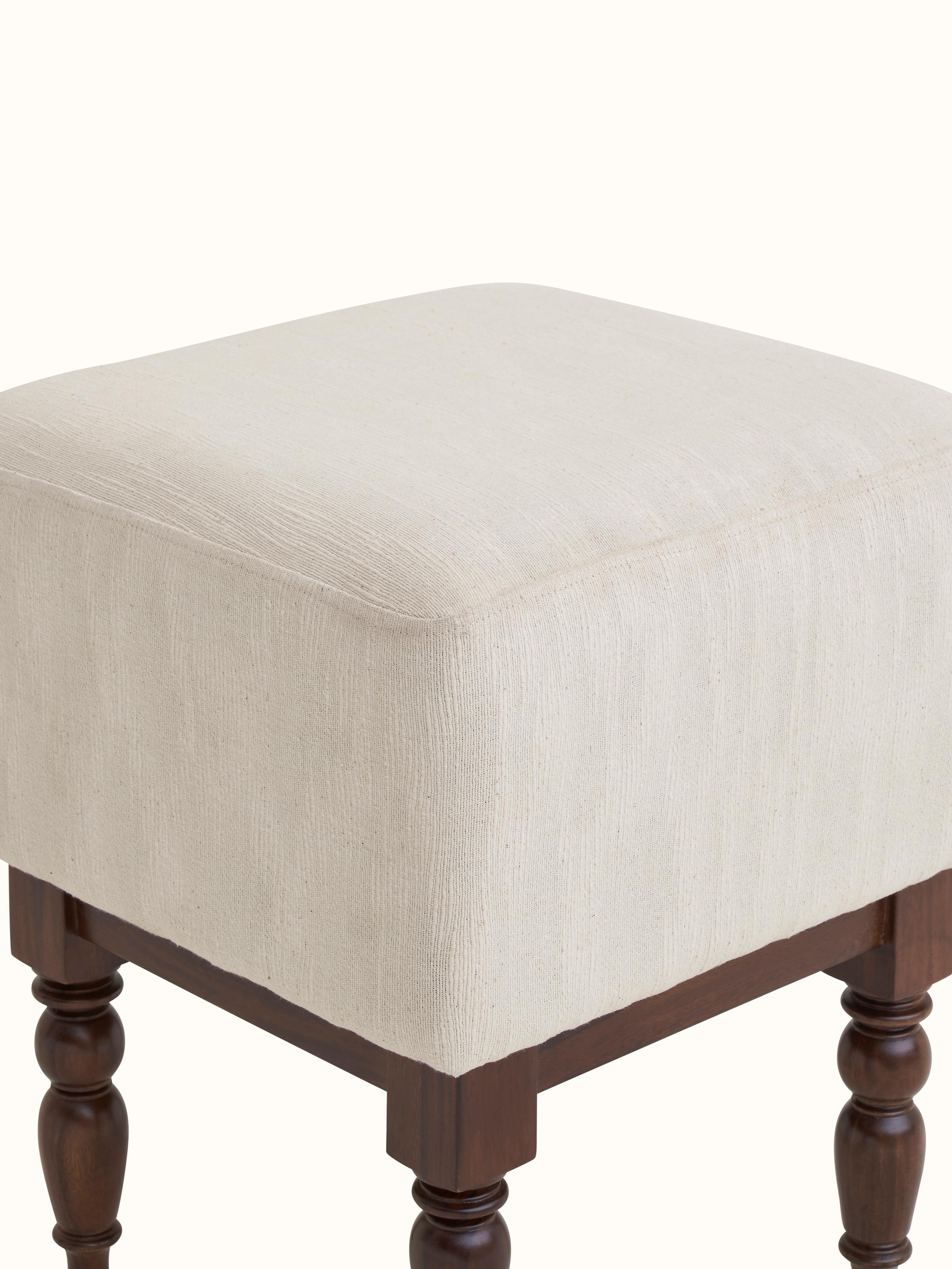 Corner view of the upholstered Sheesham wood octagonal ottoman, highlighting the seamless design and craftsmanship.
