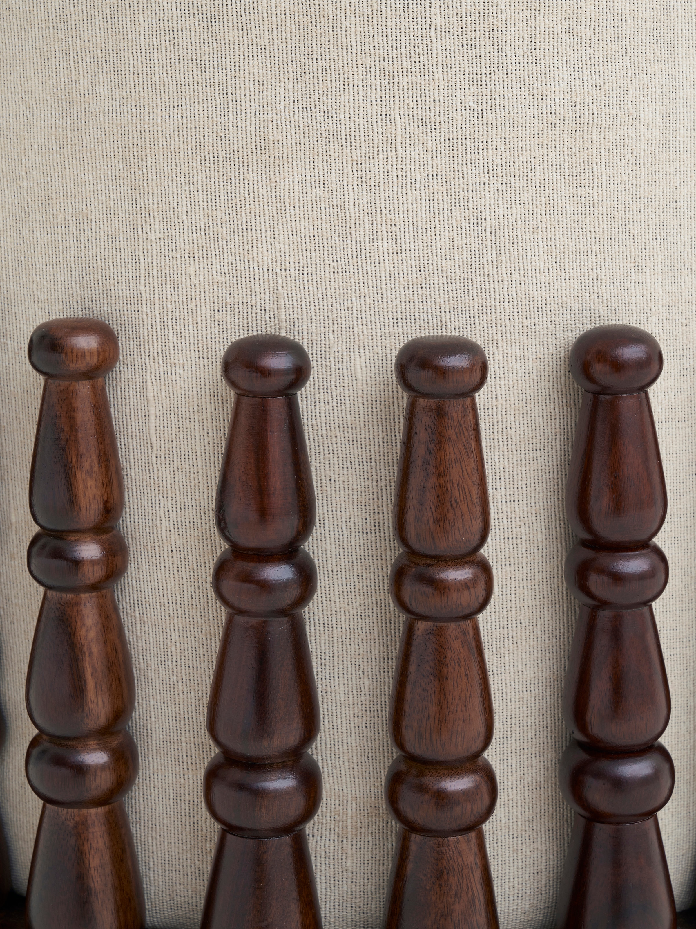 Close-up of the corner detailing and upholstery of the Sheesham wood square pouffe, showcasing its quality and finish